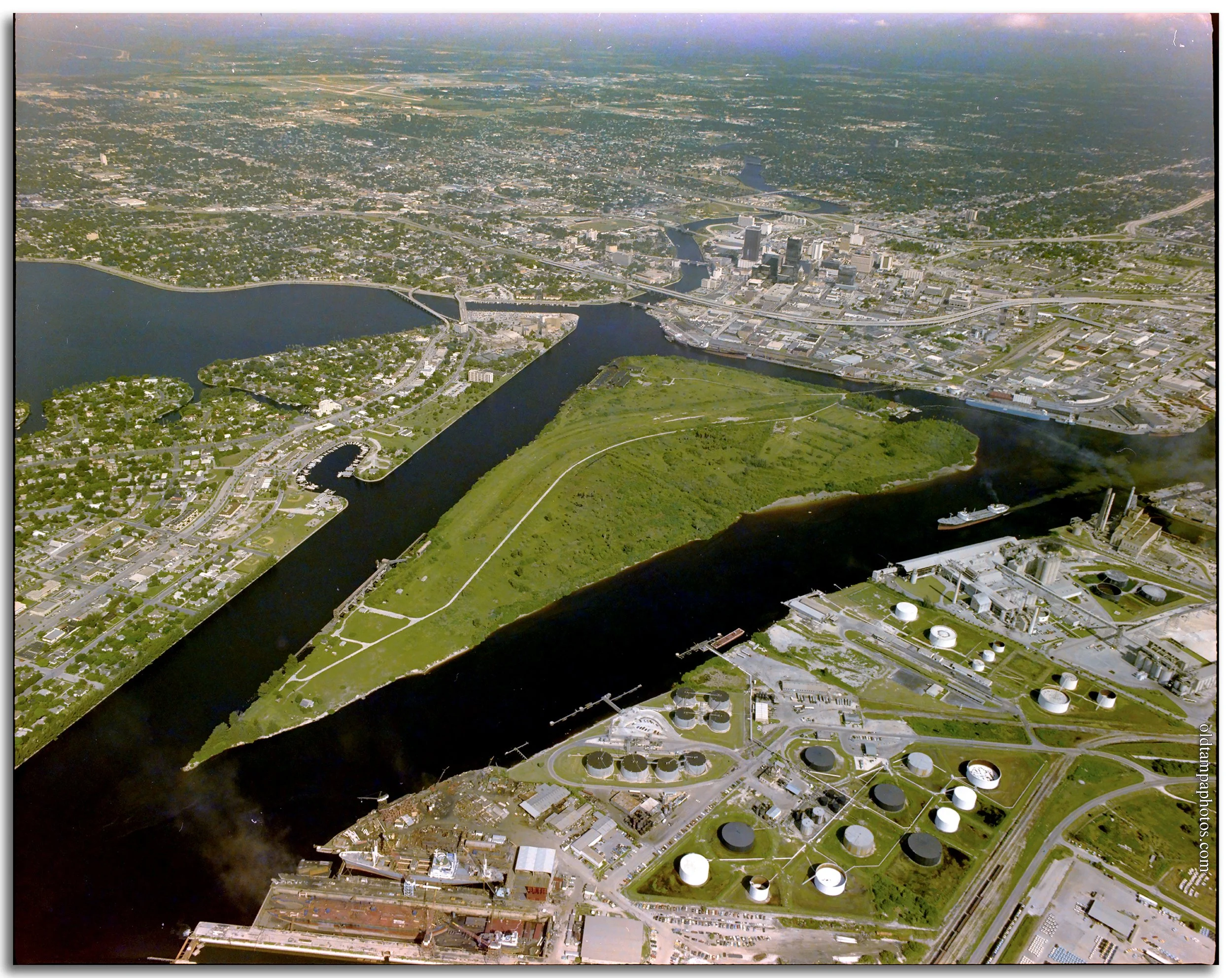 Historic photograph of Seddon Island in Tampa during the late 1970s, capturing the former phosphate shipping terminal before its transformation into Harbor Island and Tampa's modern waterfront district.
