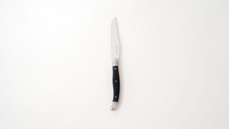 A folding pocket knife with a black handle and silver blade on a white background.