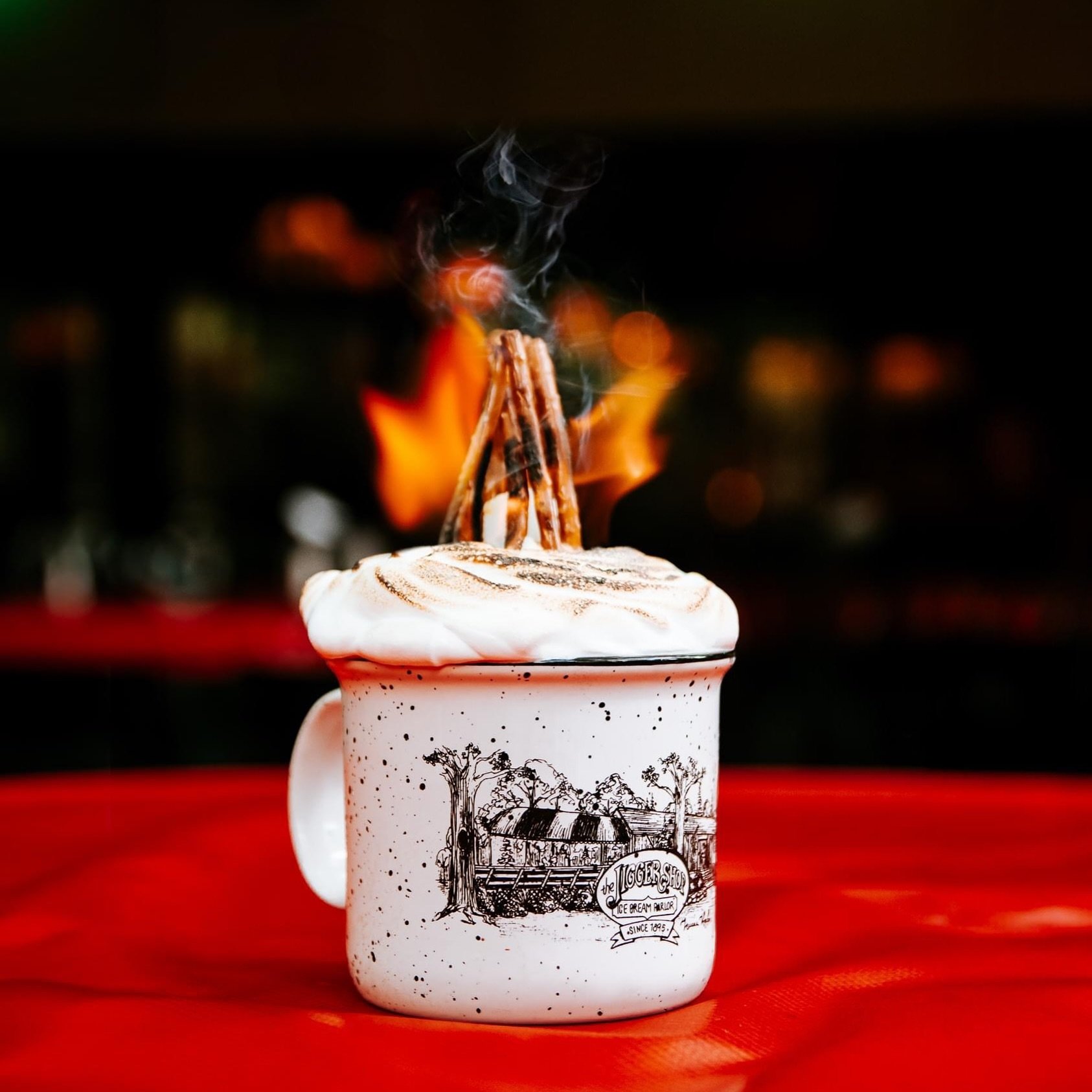 Did we mention that we light sundaes on fire?🔥 Starting on May 11th, you can get your own Bonfire S&rsquo;mores sundae served in a souvenir mug that you can take home with you!