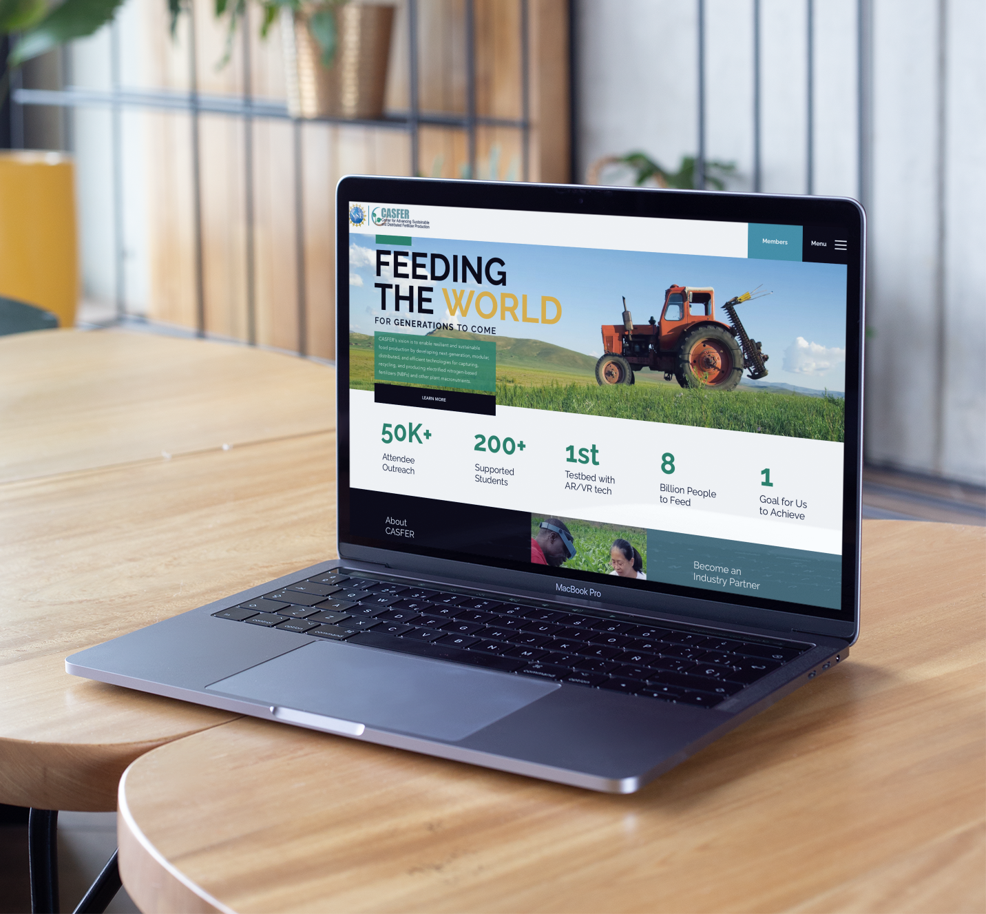 mockup-of-a-macbook-standing-on-wooden-tables-near-books-and-plants-21628.png