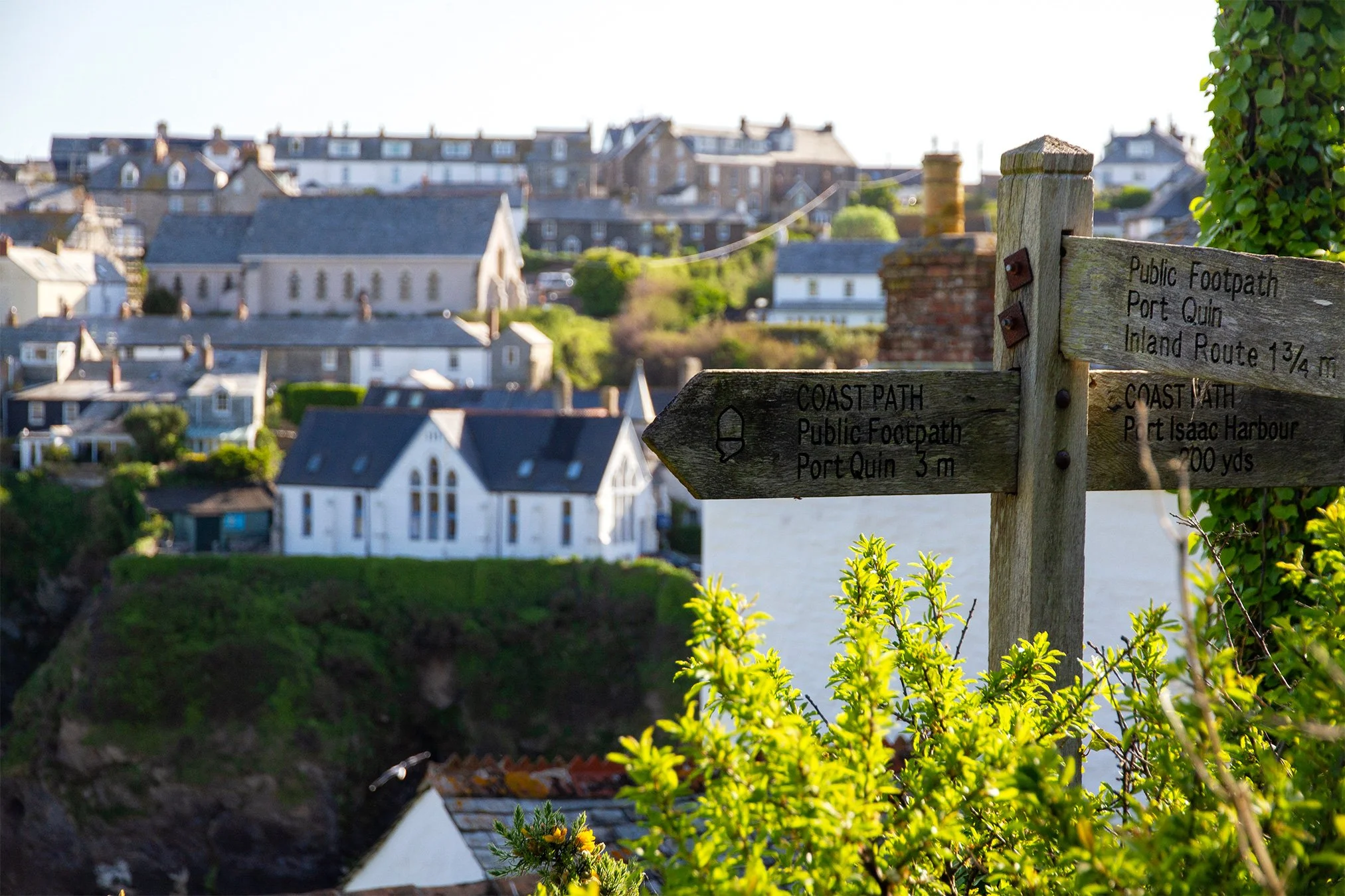 footpath signpost in port isaac, cornwall