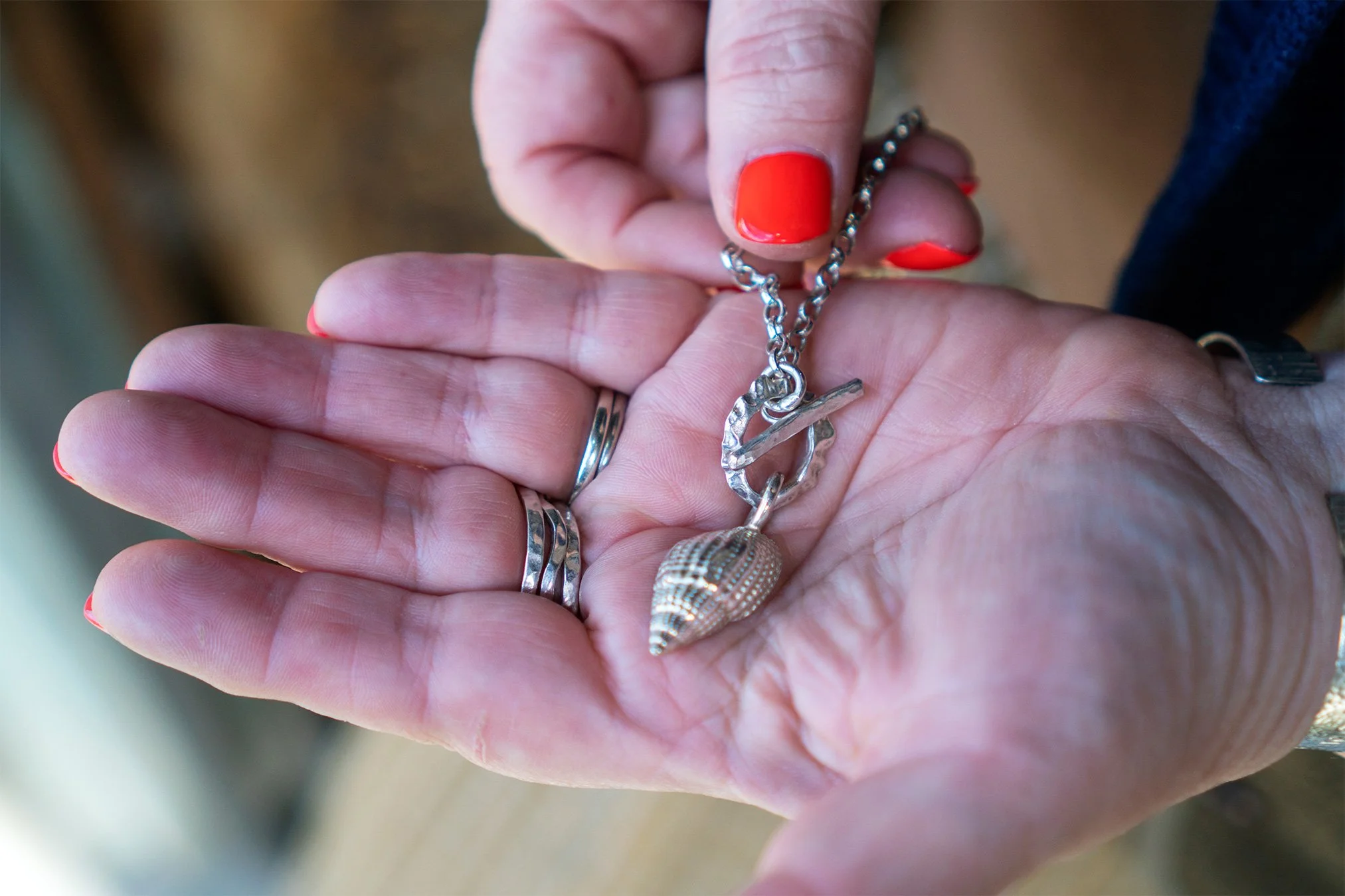silver shell charm bracelet by port isaac silversmith stacey sibley