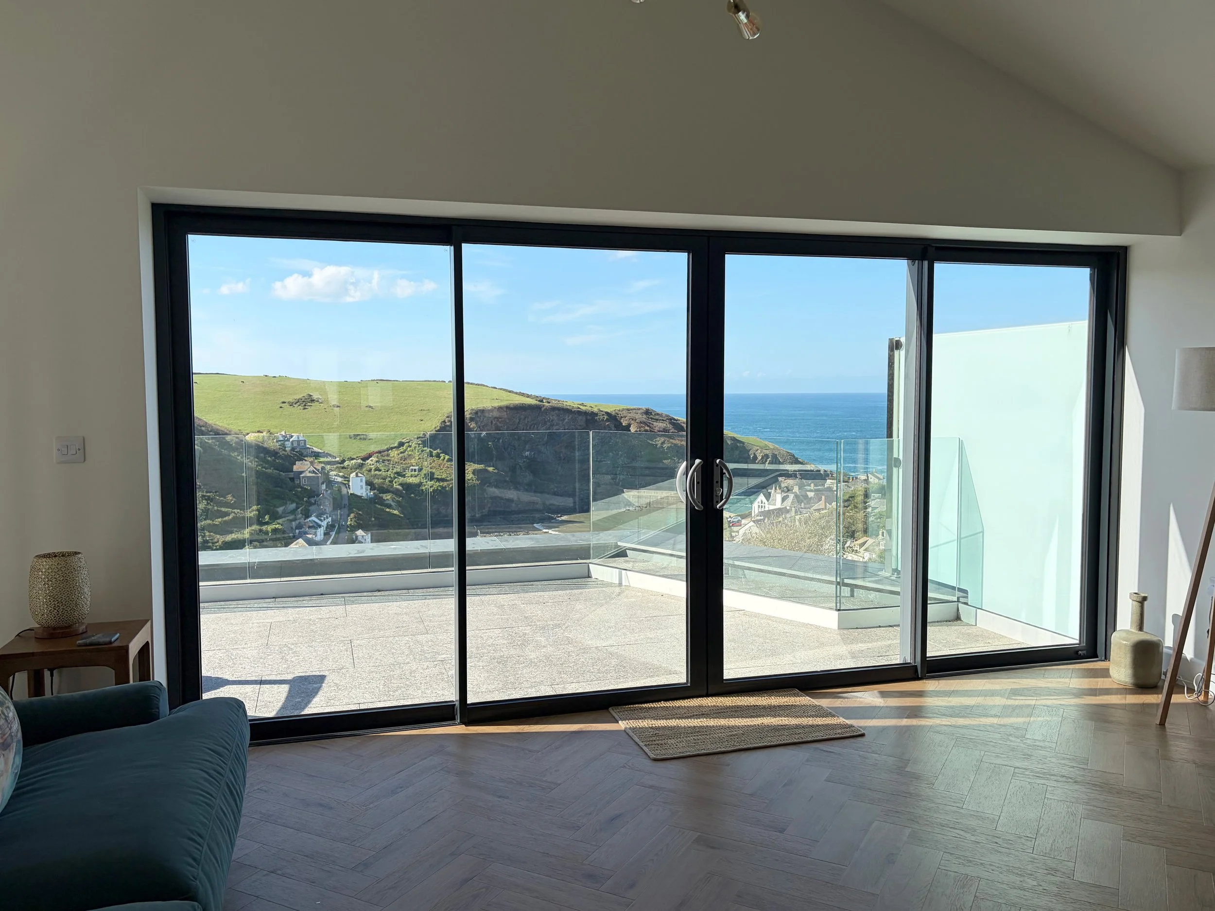 sea views over port isaac through the patio doors at pebblestones above port isaac