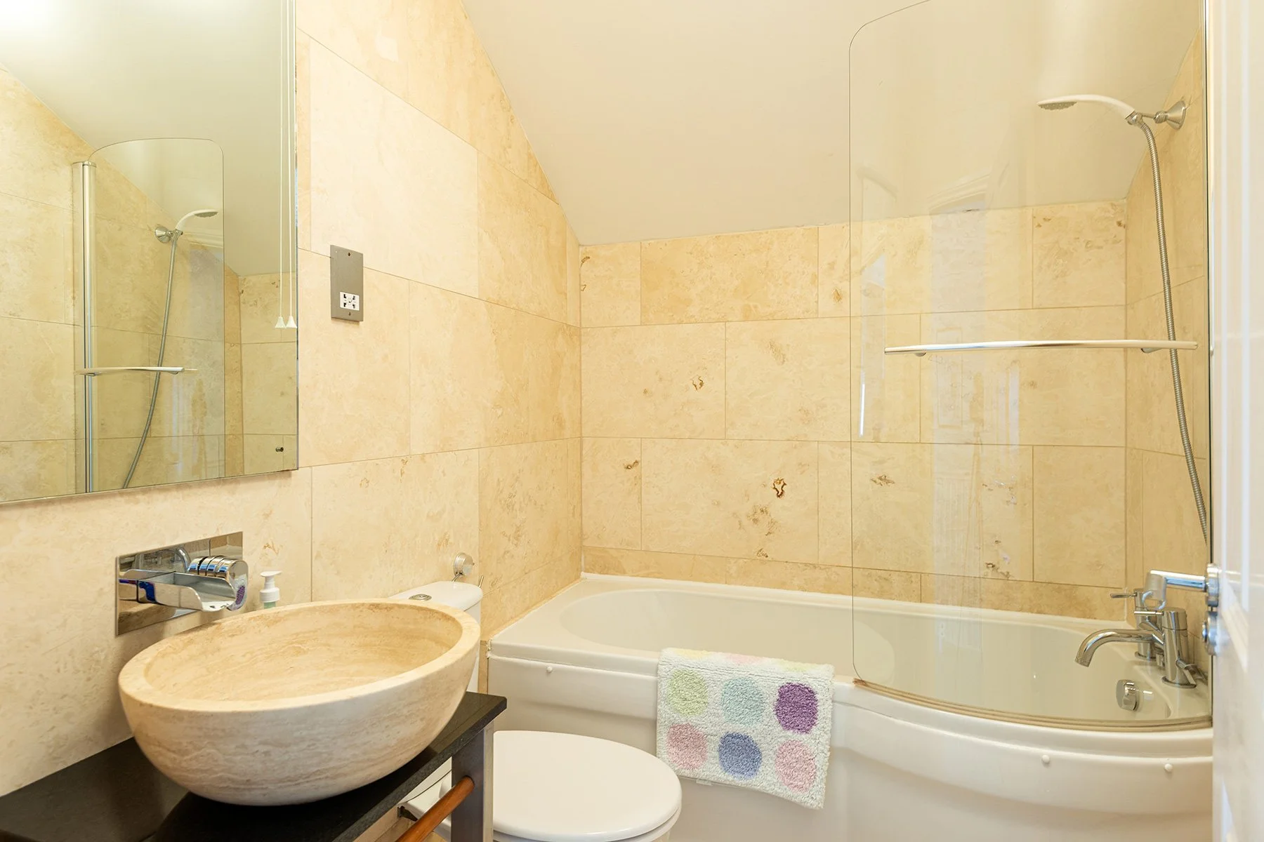 cream limestone bathroom suite
