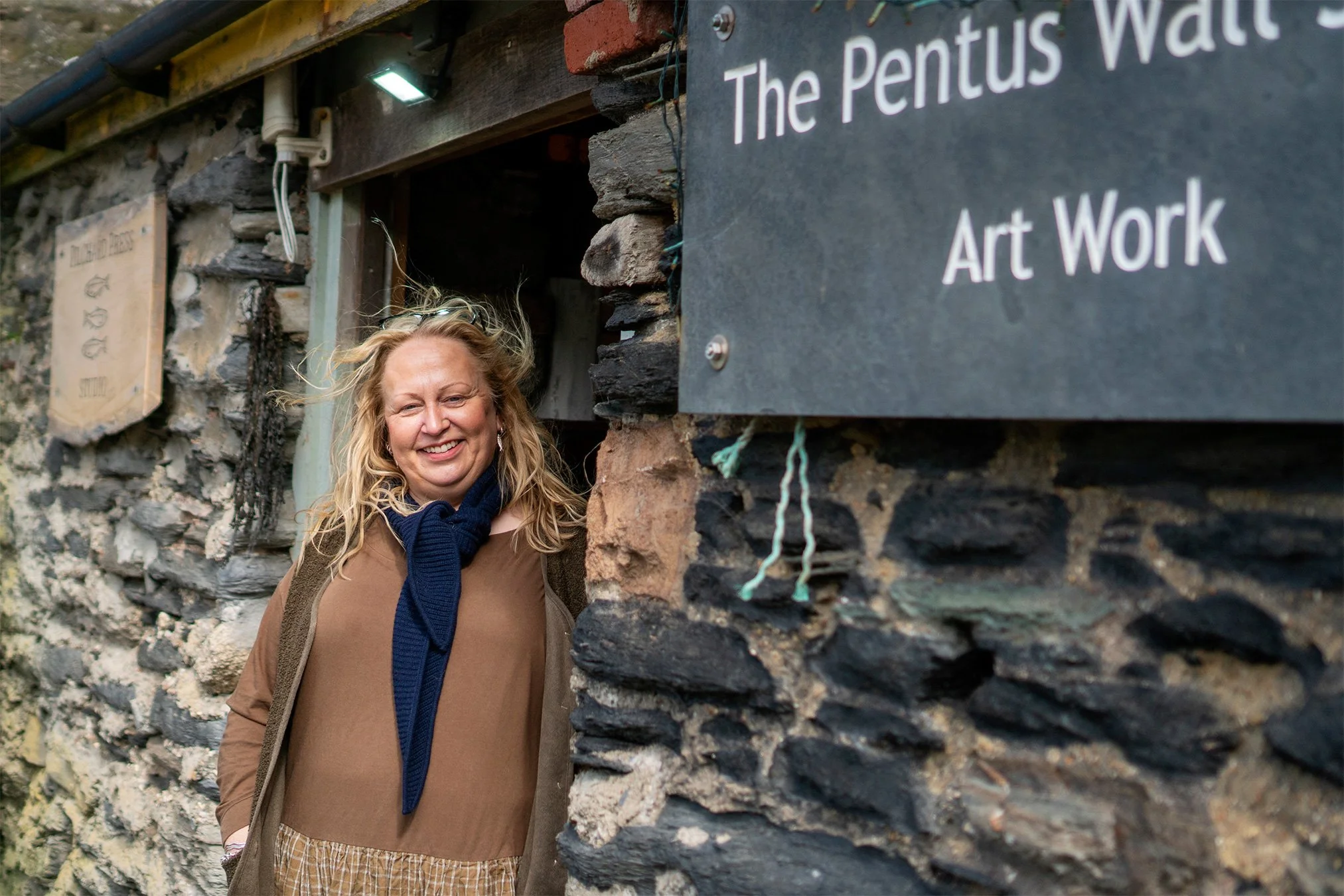 artist stacey sibley outside her studio in port isaac