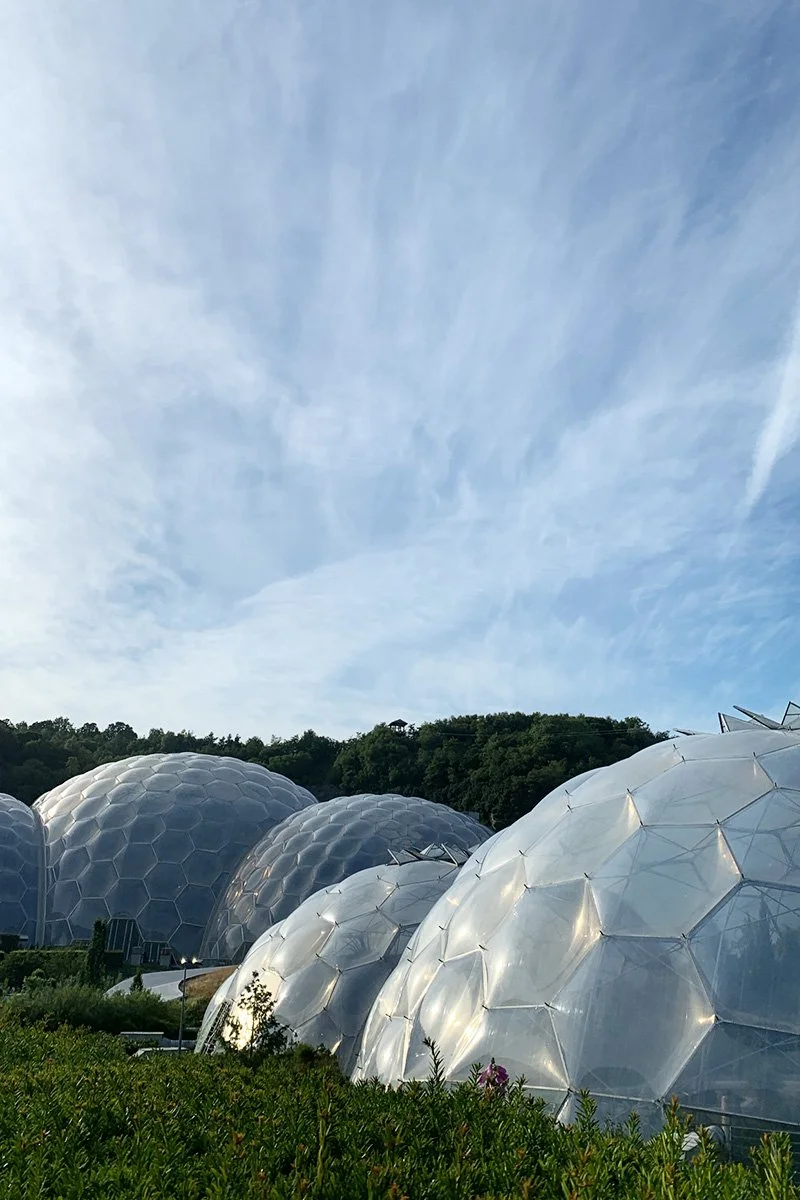biome domes under a blue sky at the eden project in summer
