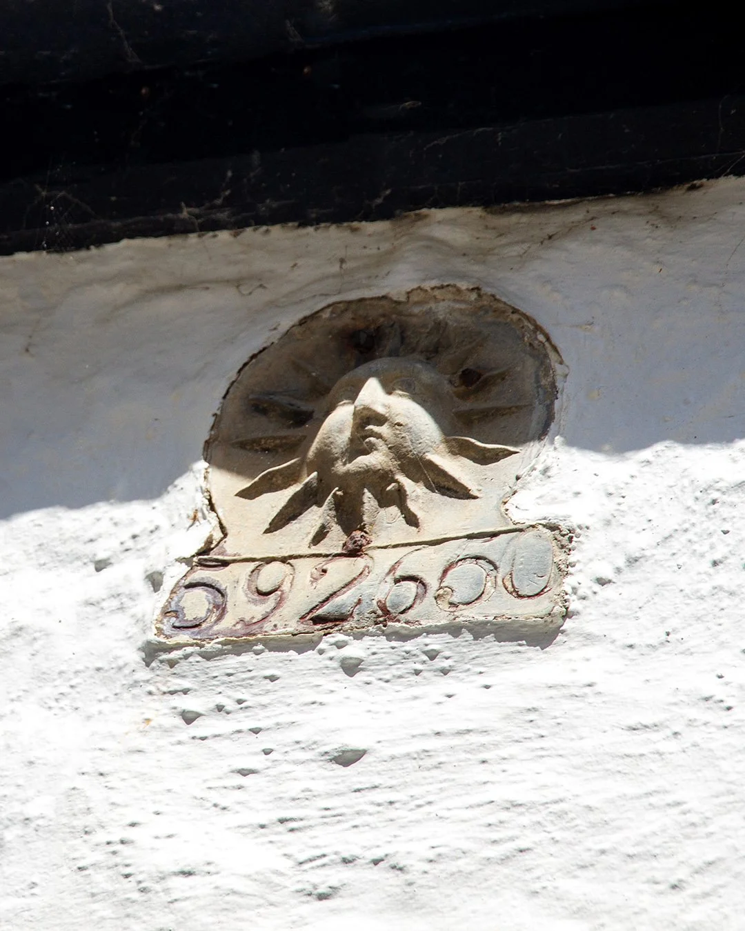 plaque of the sun fire insurance office on the wall of the dolphin in port isaac