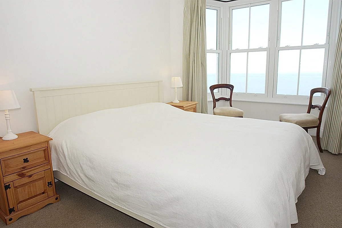 bedroom with sea view at bellevue in Port Isaac