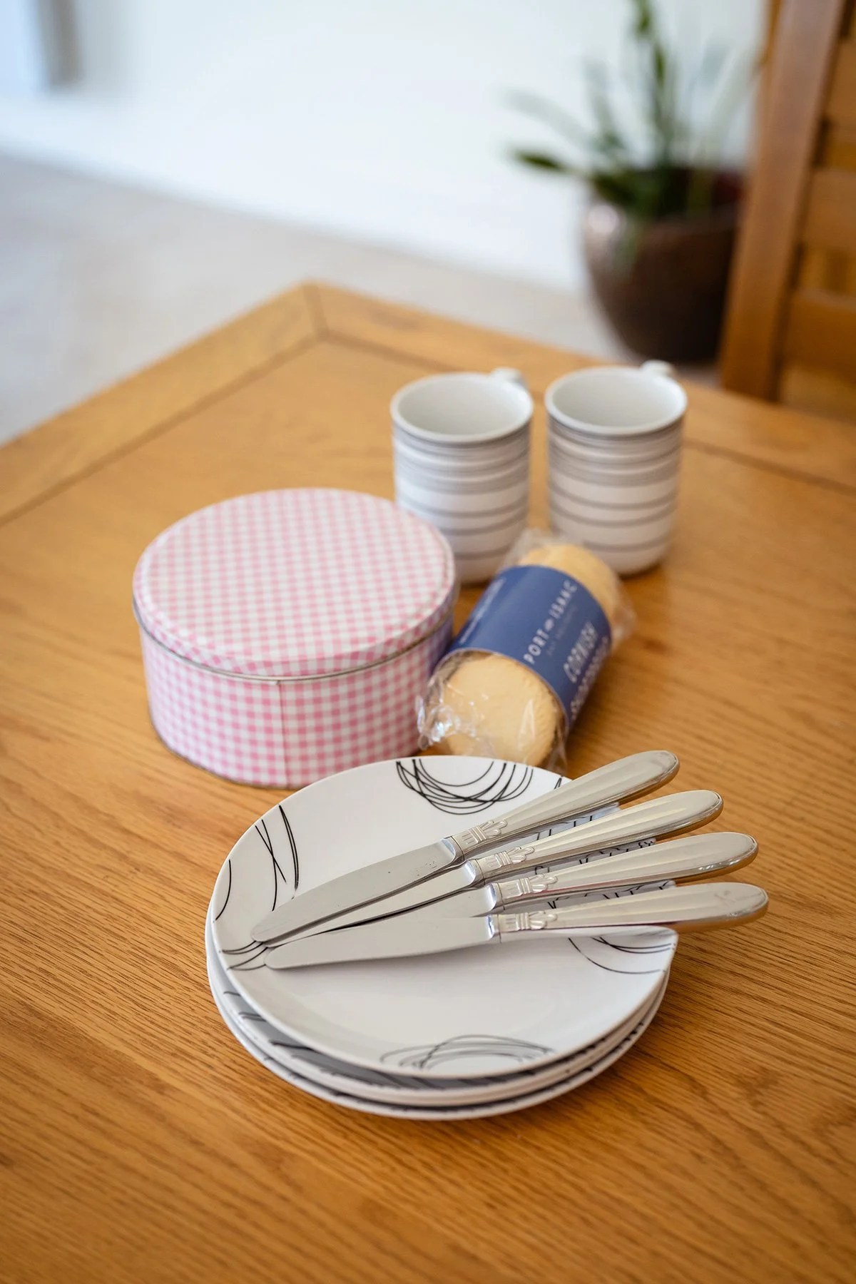 a stack of plates and complimentary shortbreads