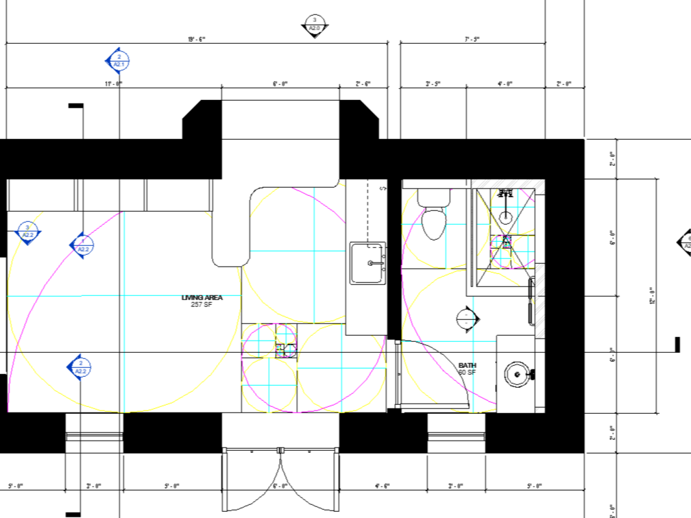 Architectural floor plan of a small living space with a living area and bathroom. The plan includes measurements, wall thicknesses, and room layouts.