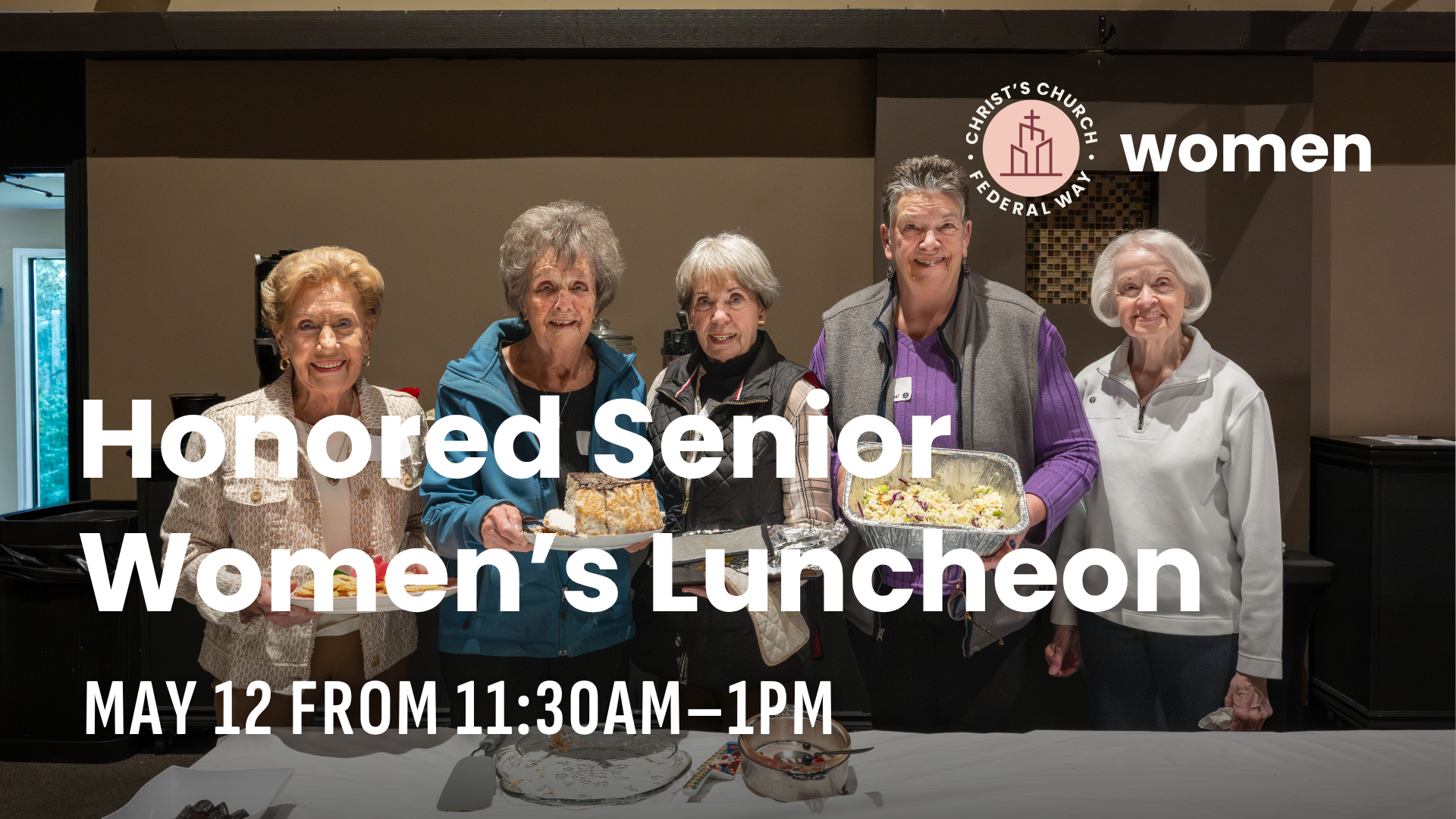 A group of senior women and one man standing behind a table with food, celebrating at a women's luncheon event. There are cakes, salads, and appetizers on the table. The background has a wall with the Christ's Church Federation Way logo and text indicating it is a women's event.