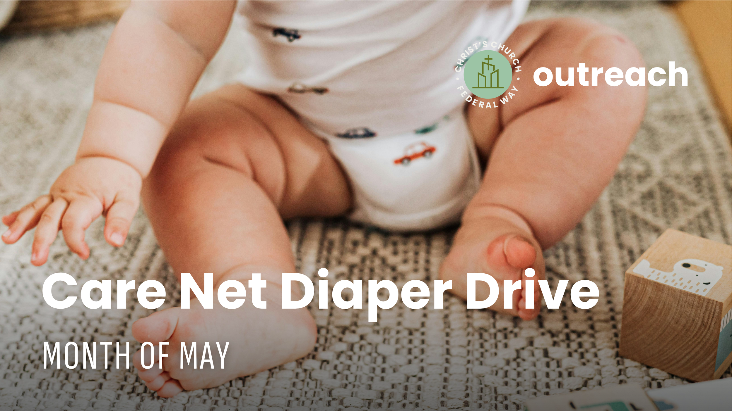 Close-up of a baby sitting on a textured rug, reaching out with their left hand. The baby is wearing a white shirt with small, colorful car prints. In the background, there is a wooden toy block with animal illustrations and a small part of the text "Care Net Diaper Drive" with smaller text indicating "Month of May". The website logo for Christ’s Church Federawey Outreach is at the top right corner.