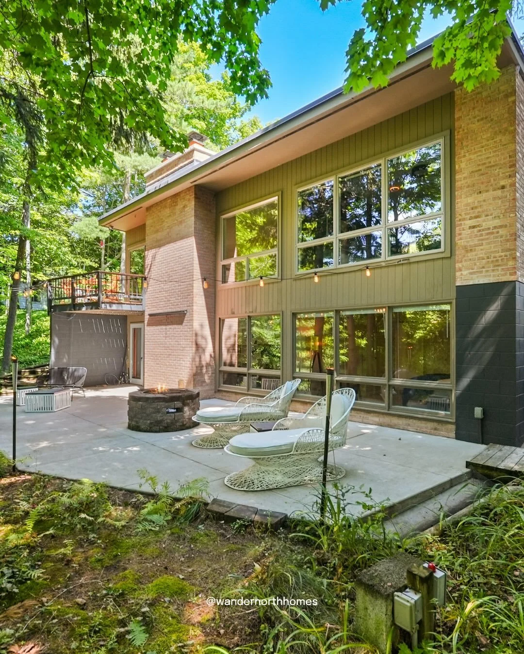 Introducing Midcentury Millpond, our newest property in the heart of Northport, right on the banks of the historic Mill Pond. 

A lovingly restored mid-century home with original wood beams, a stone fireplace, and floor-to-ceiling windows that bring 