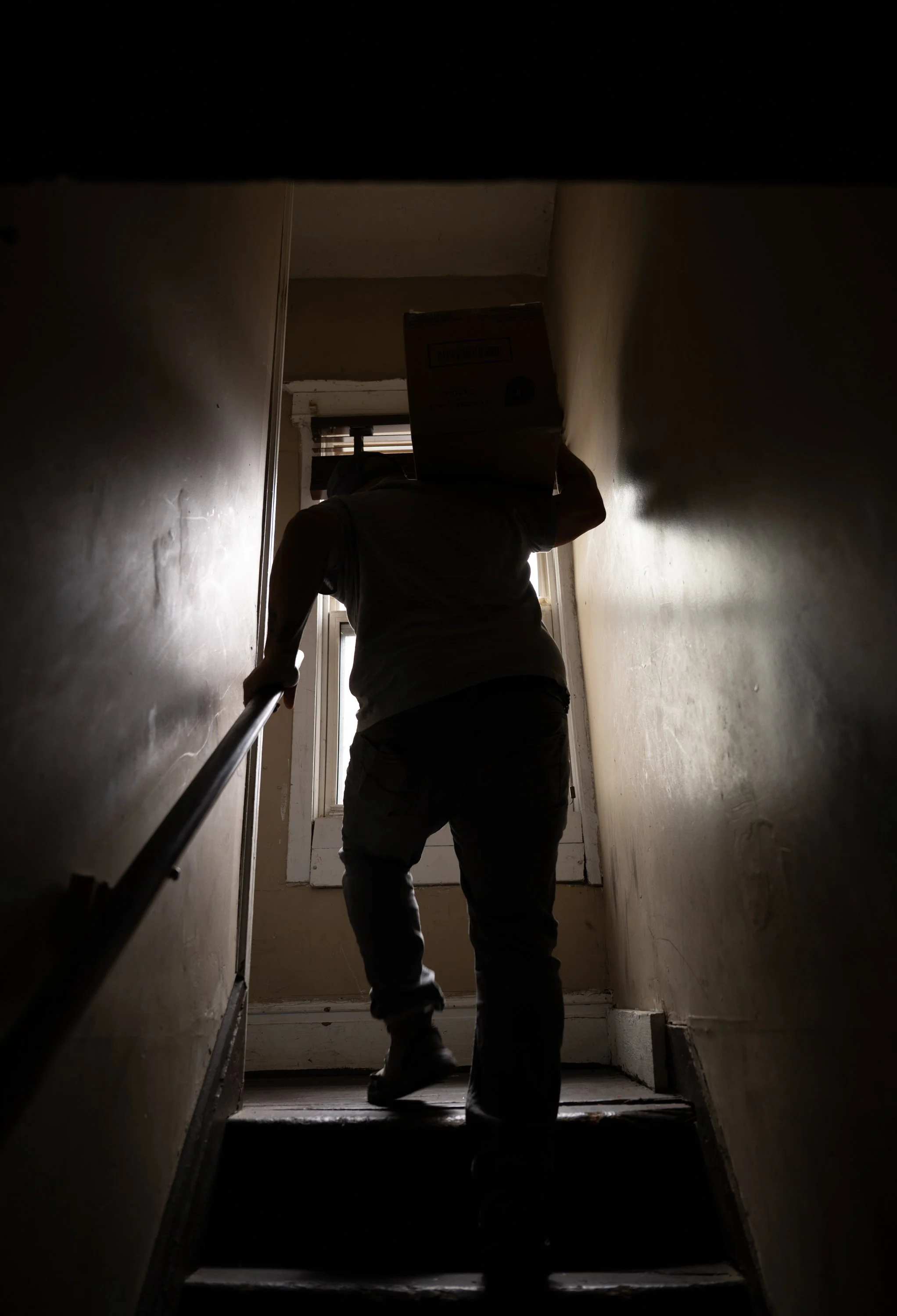 Stephen Rosa carries food and groceries up to Robin Carpenter's room on April 17, 2026. Rosa came to check in on the current condition of the house and take pictures for records.