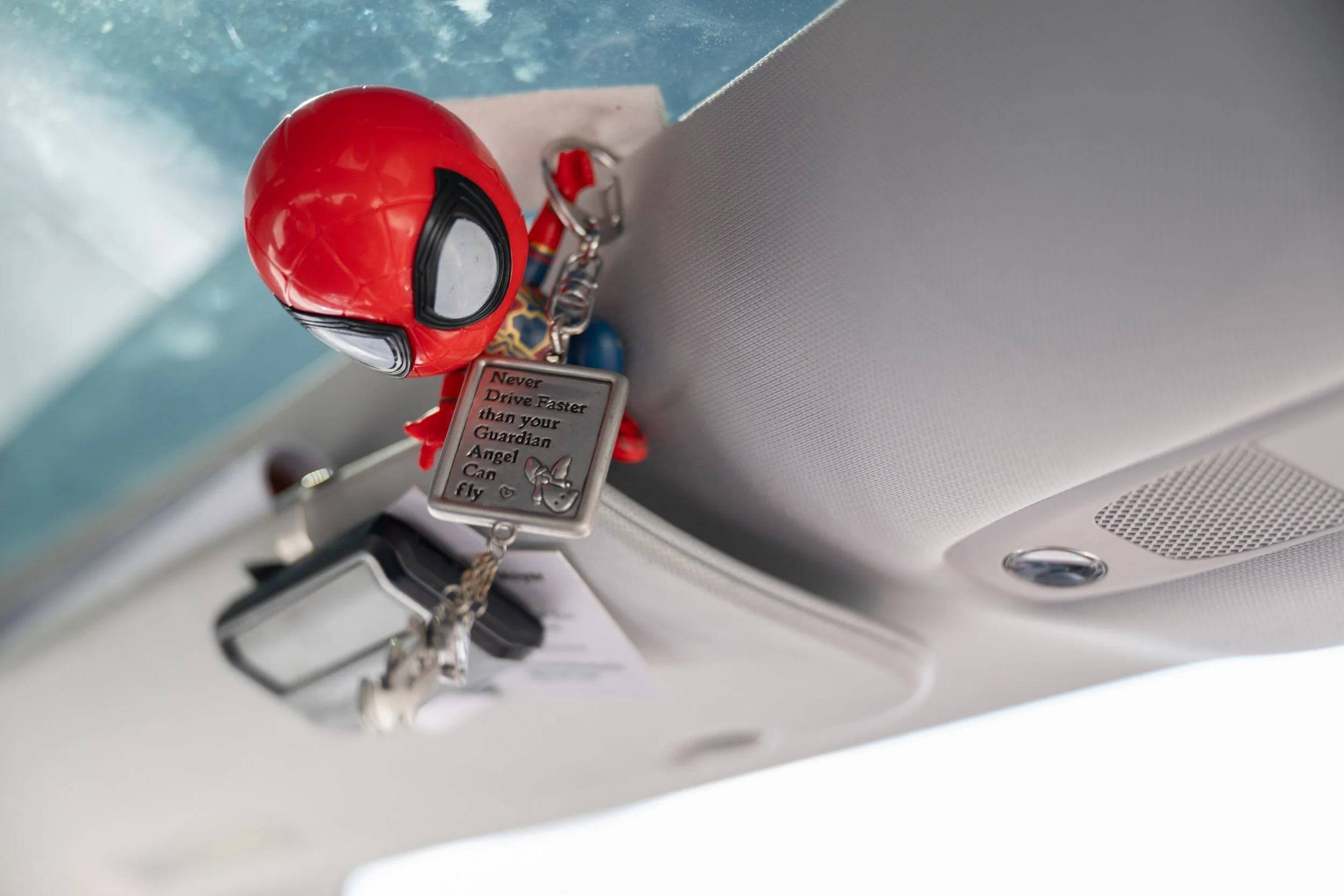 A keychain hangs in Stephen Rosa's car on March 9, 2026. The keychain was given to Rosa by one of his kids.