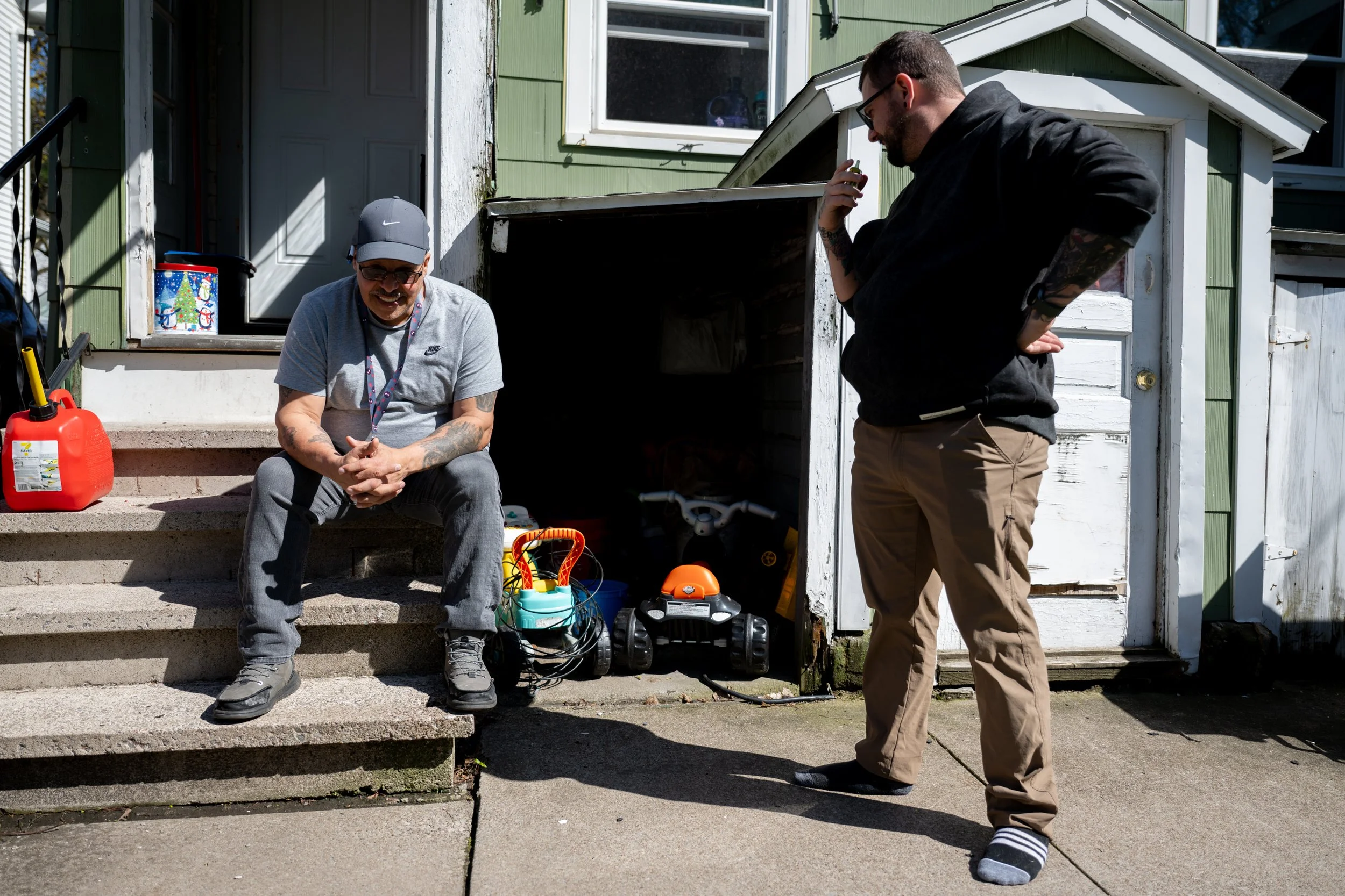 Stephen Rosa talks with his friend, Robert Pesa outside Pesa's home on April 17, 2026.