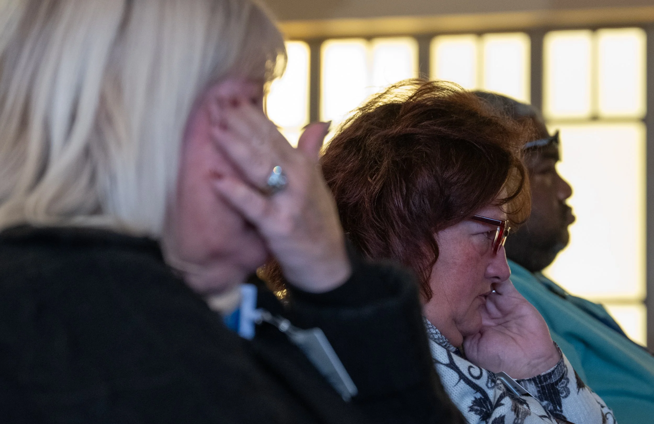 Audience members react to the speech delivered by health Reach CEO, Michael Hudson, during the 2025 National Homeless Persons’ Memorial Day event at the St. Mary’s Campus Chapel on Dec. 18, 2025. 