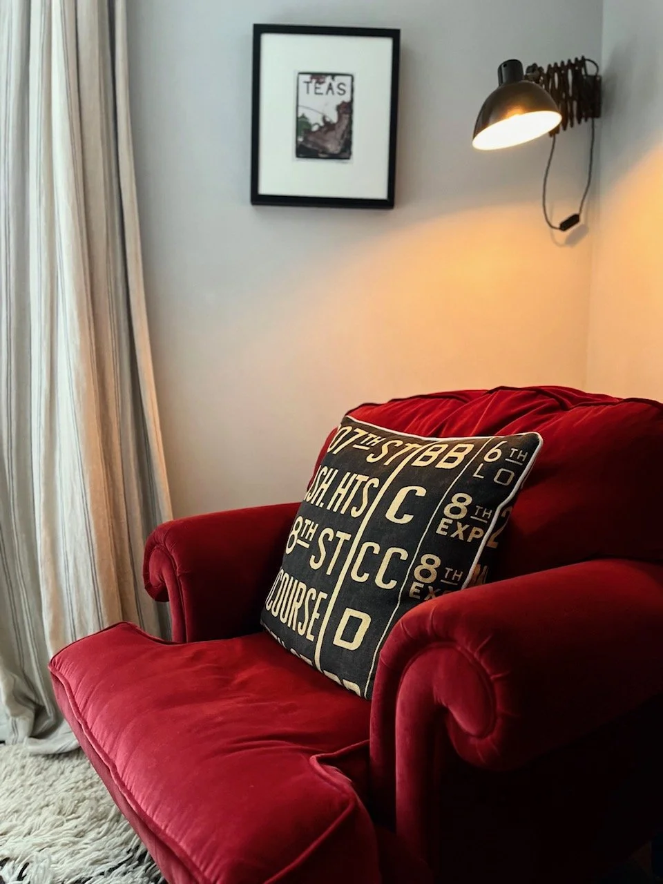 Comfy red bedroom chair with cushion