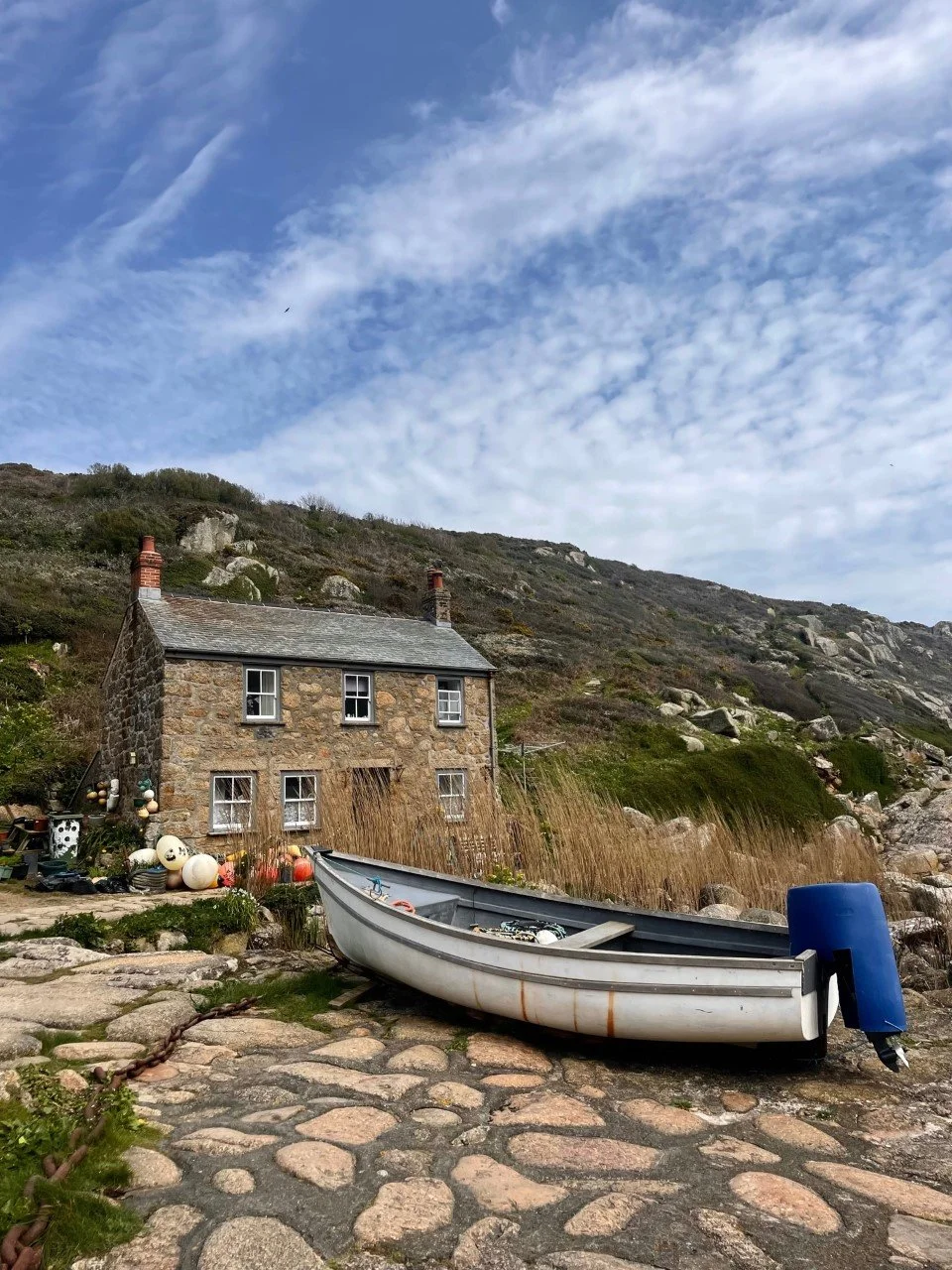 House and boat close-up in a Cornish cove