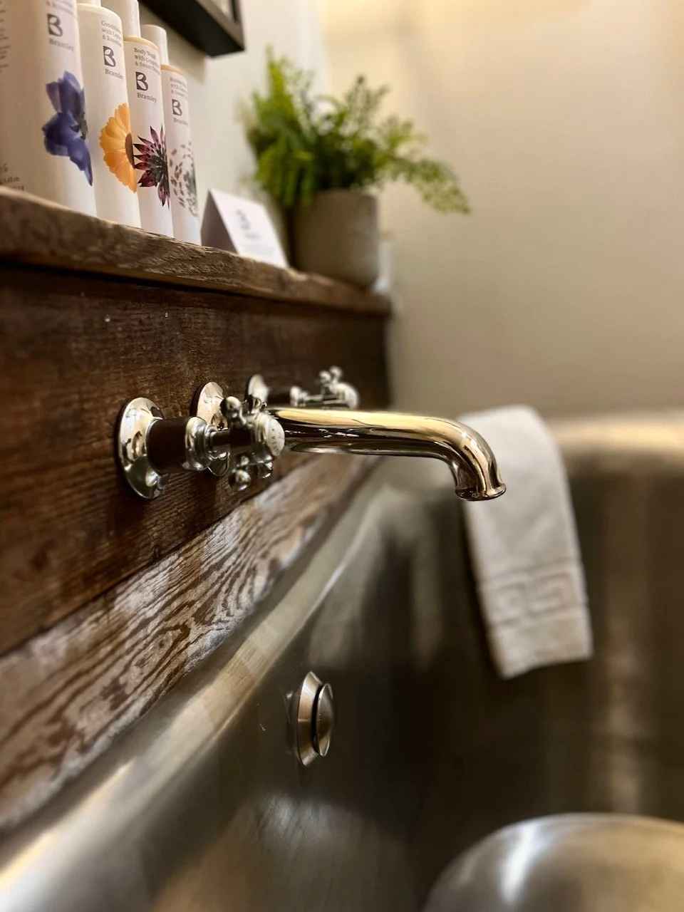 Close up of bathtub taps and products