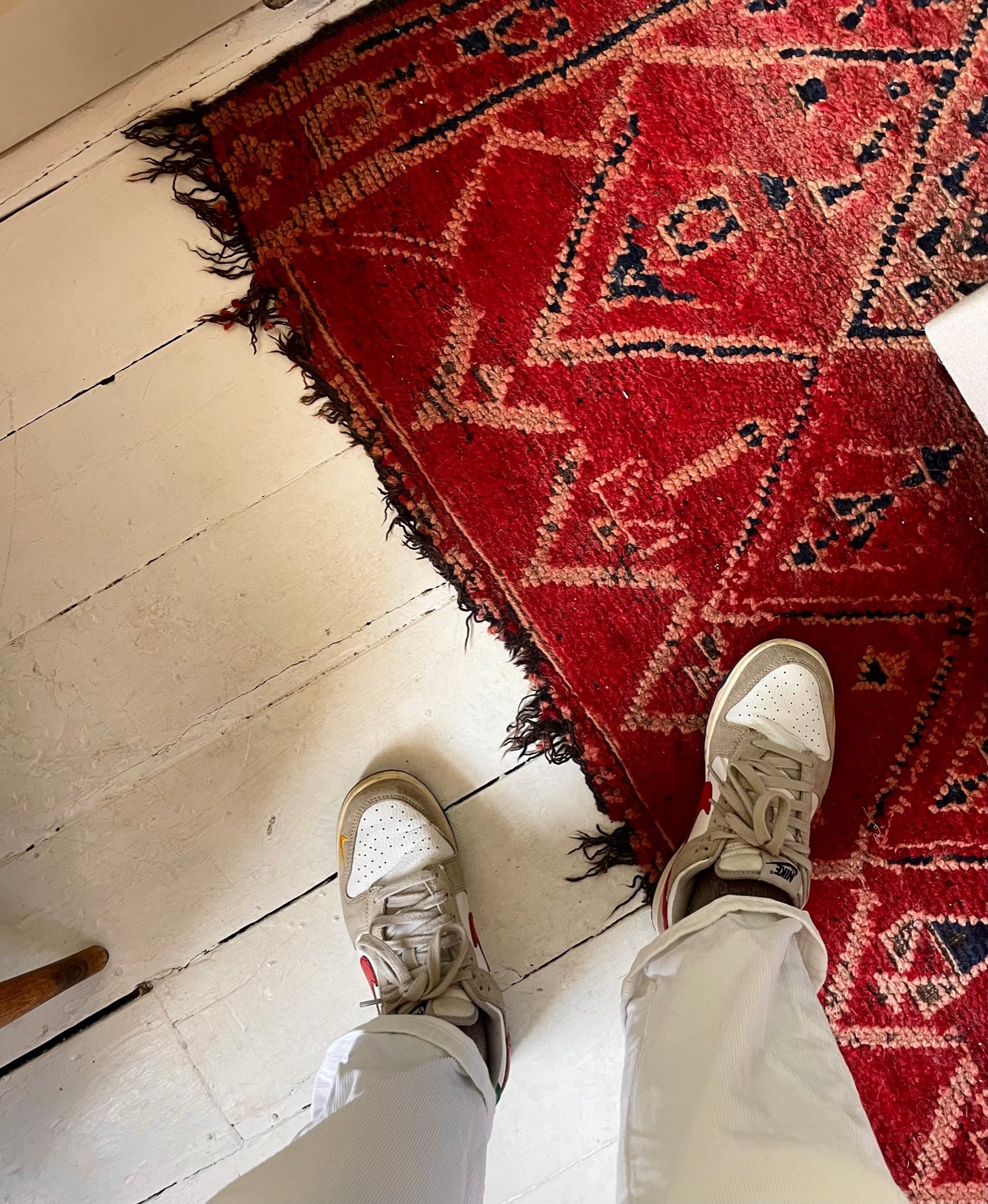 Artisan red rug details and legs