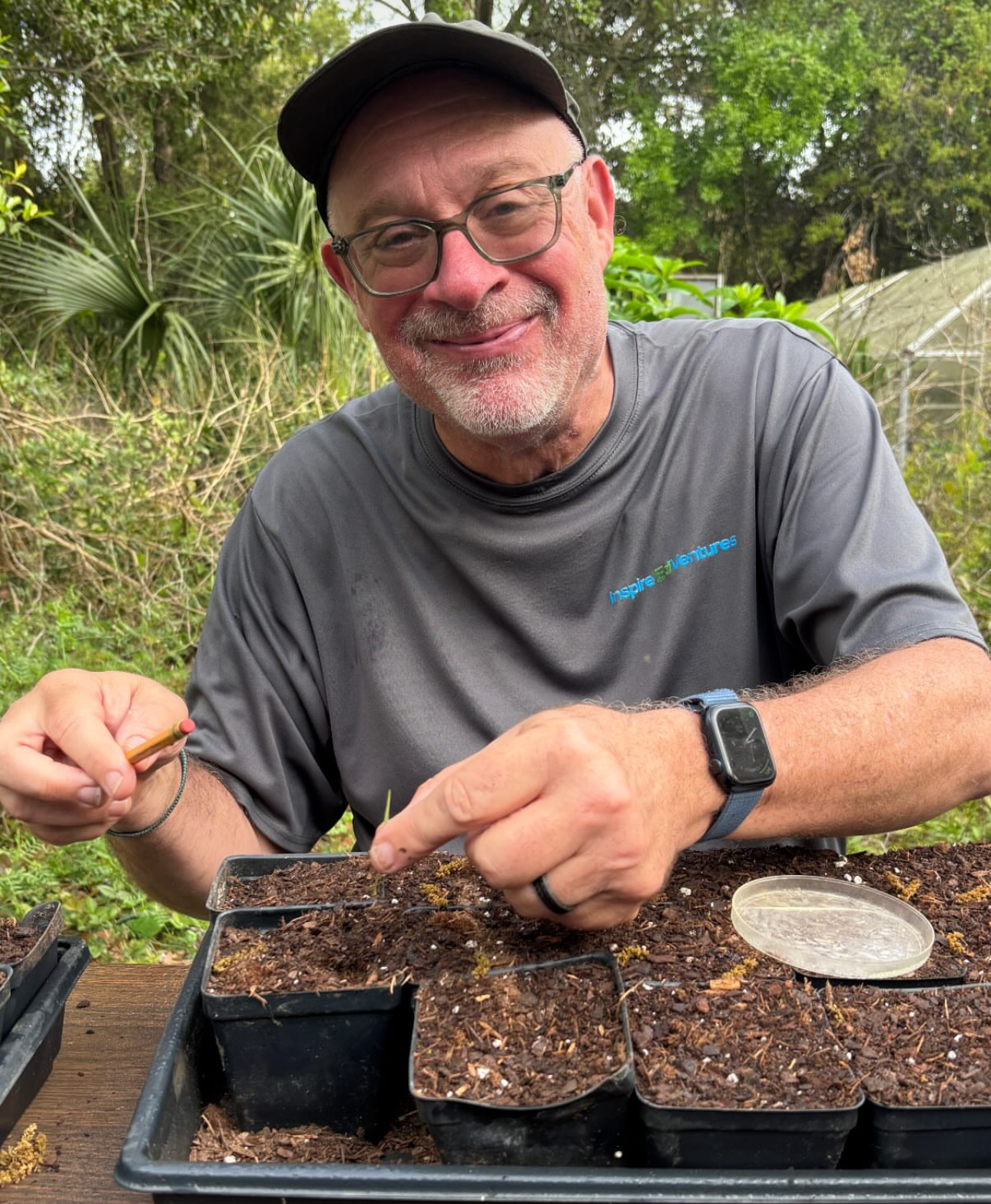 Micheal Windelspecht planting marsh grasses for a conservation project in Charleston