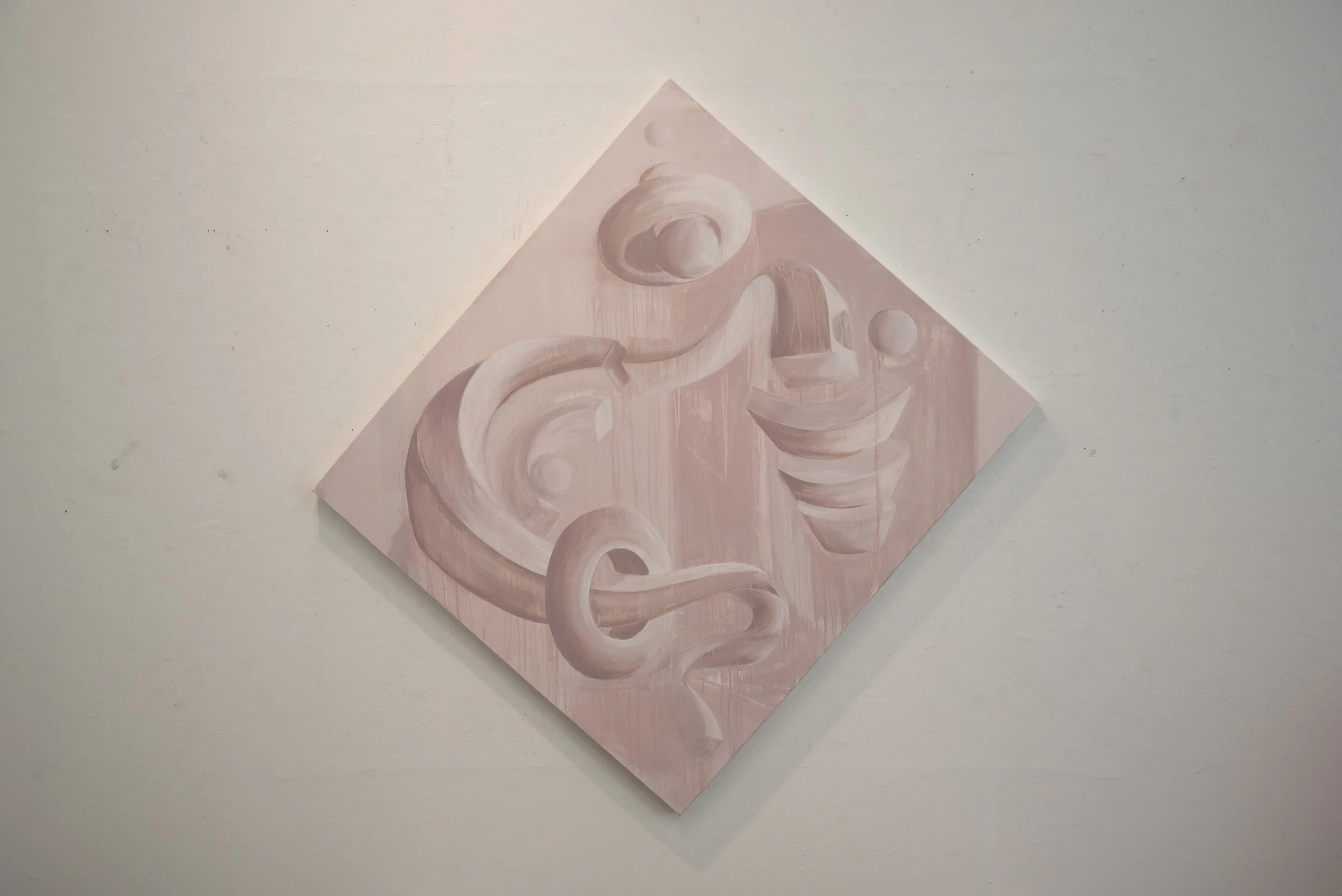 Abstract pink painting with geometric shapes, lines, and curves on a white wall.