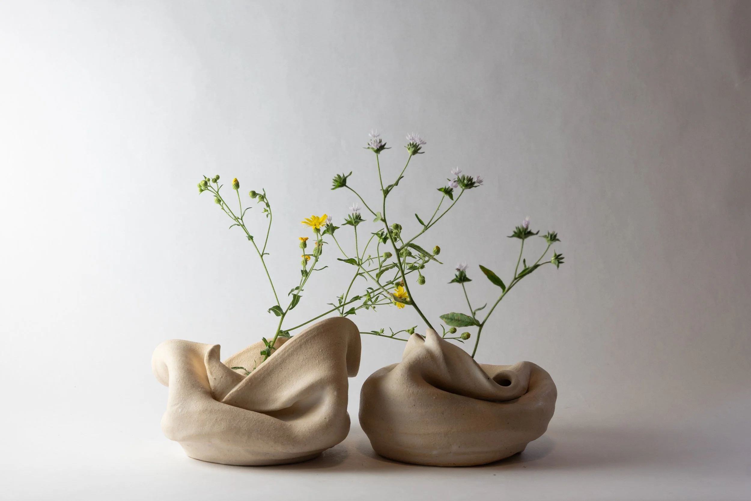 Two matte white slumped vases.jpg