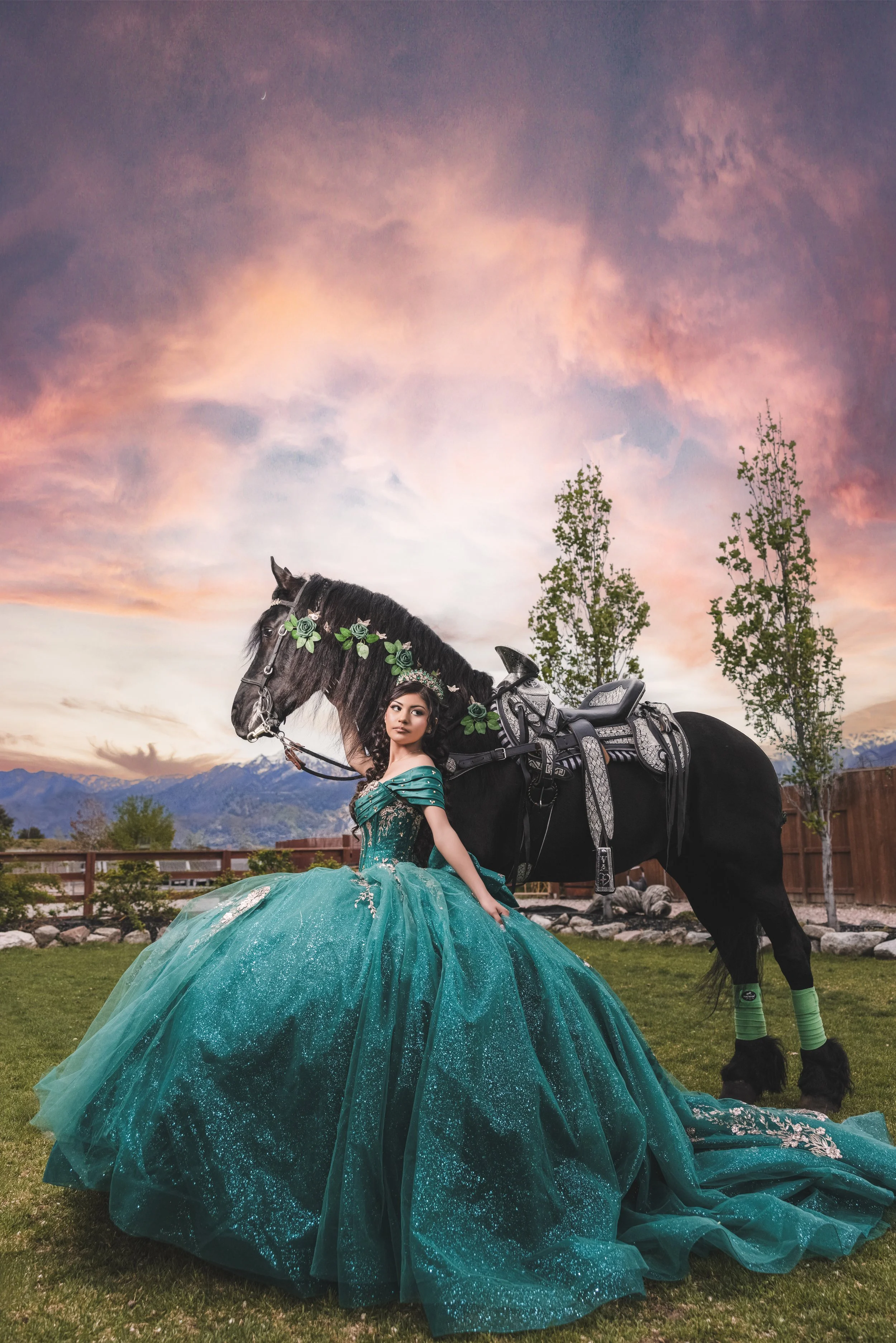 A luxury quinceañera portrait session at Rancho La Gloria in Utah, featuring close-up photography with a black horse and elegant emerald dress styling.