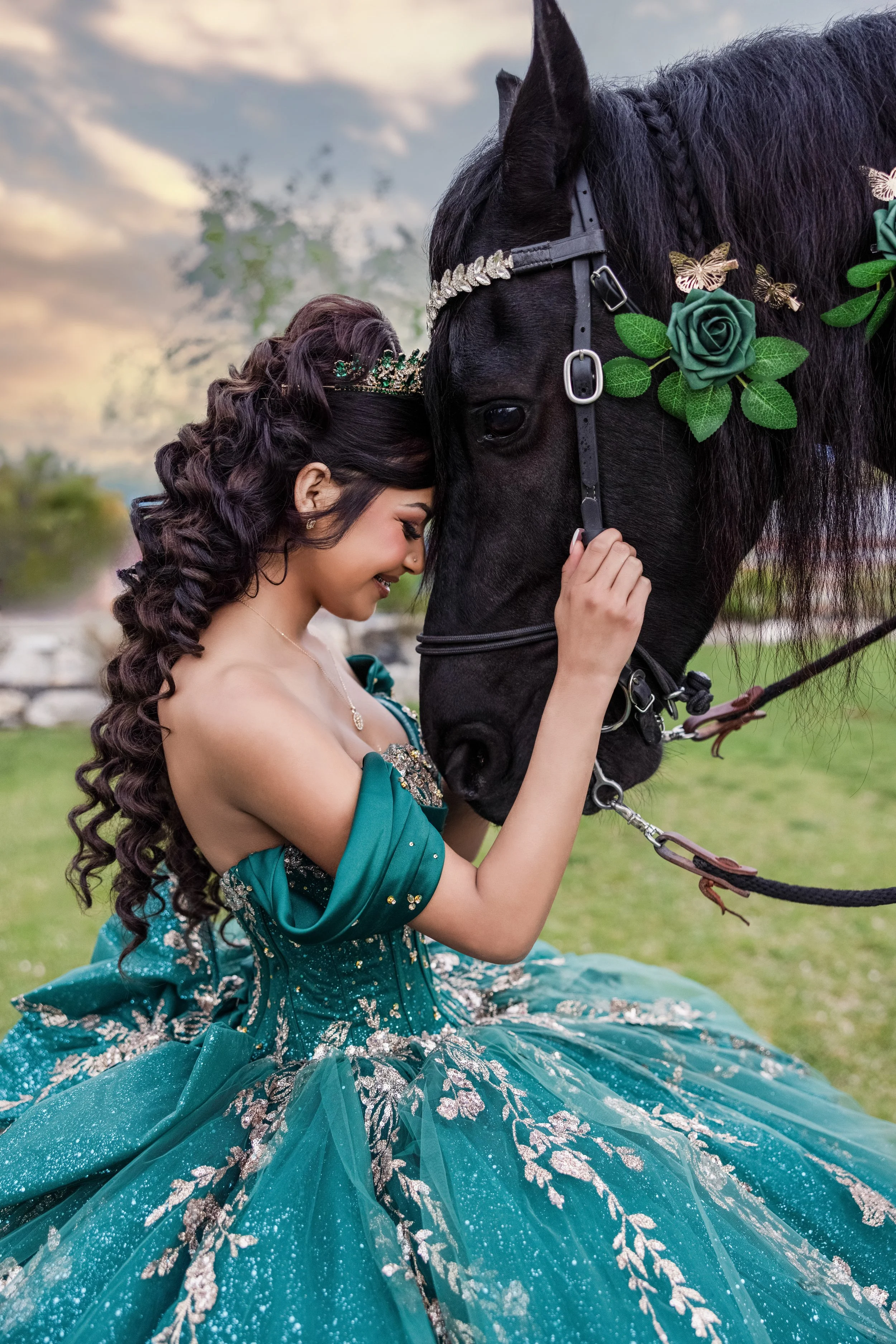 A soft and elegant quinceañera photoshoot at Rancho La Gloria in Utah with a black horse, emerald dress, and guided posing for a memorable portrait experience.