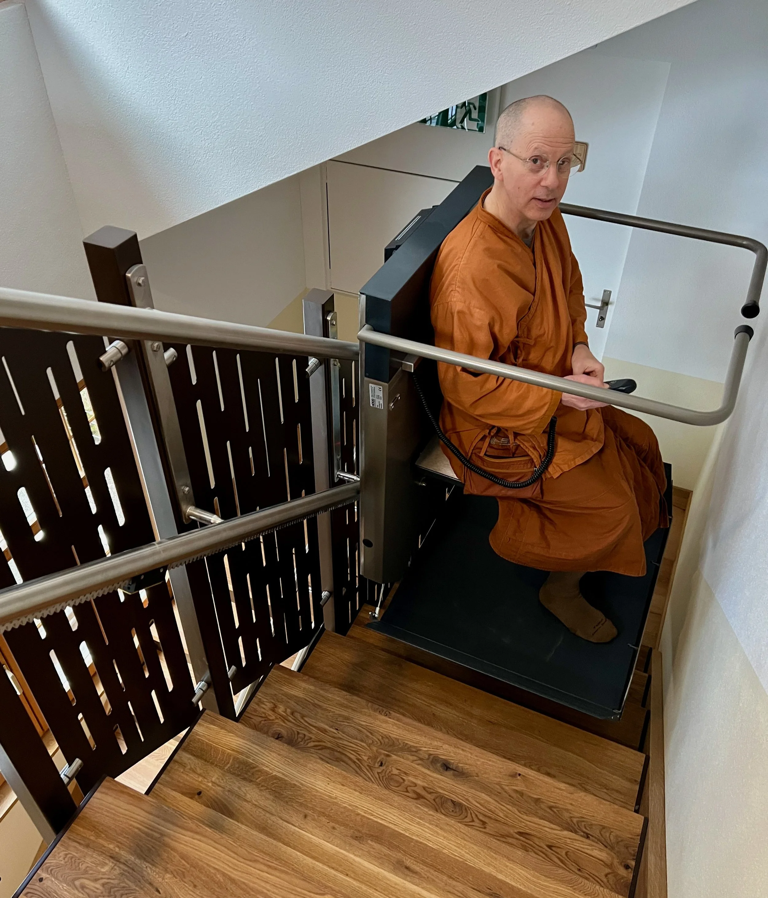 A.Ahimsako using stairlift.jpeg