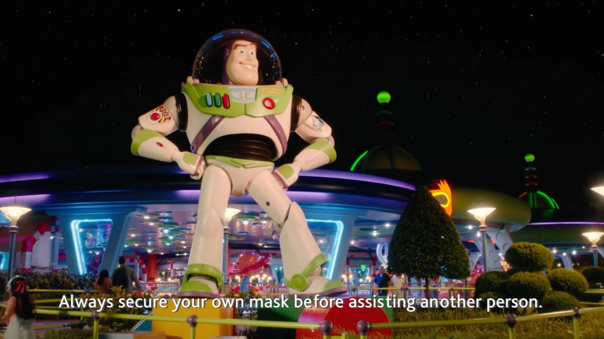 Air Canada's Disney-themed safety video featuring a Buzz Lightyear statue with the caption 'Always secure your own mask before assisting another person.'