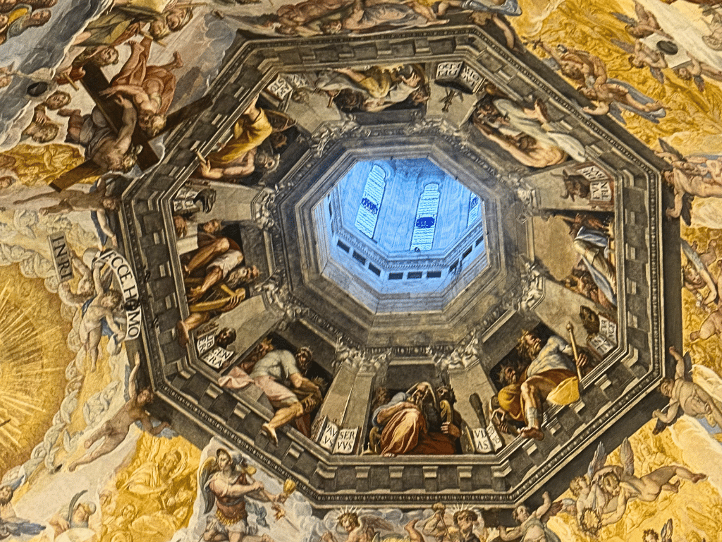 Looking up at the painting on the ceiling of the Duomo in Florence