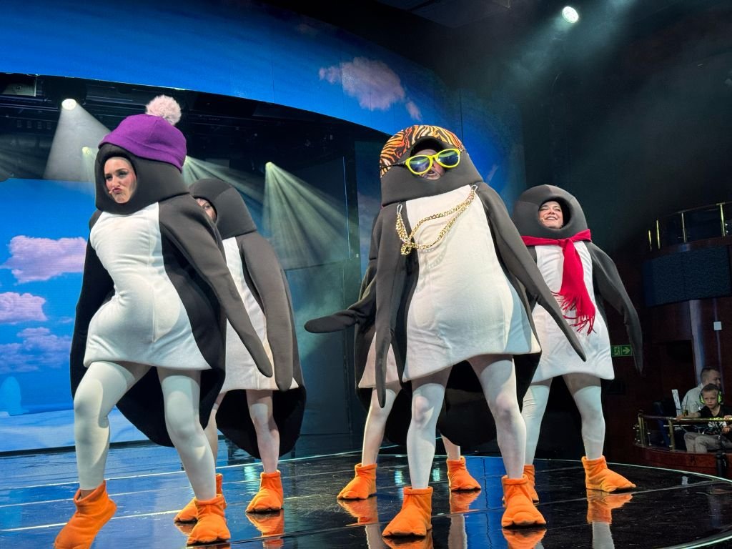 Penguins in costume dancing to Ice Ice Baby on the MS Color Fantasy