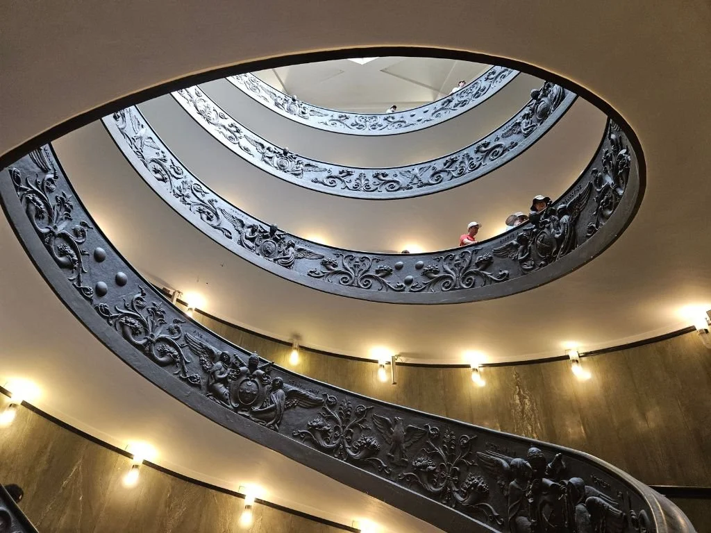 The balance curves of the ornate staircase in the Vatican Museum