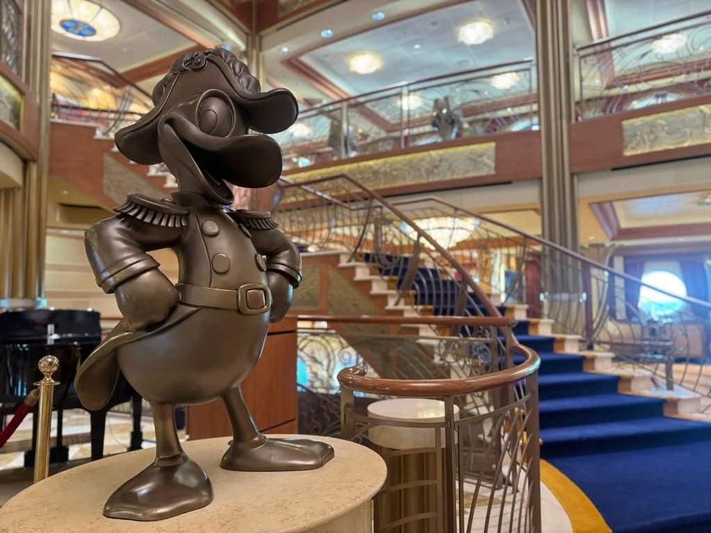 Statue of Admiral Donald Duck in the atrium of the Disney Dream