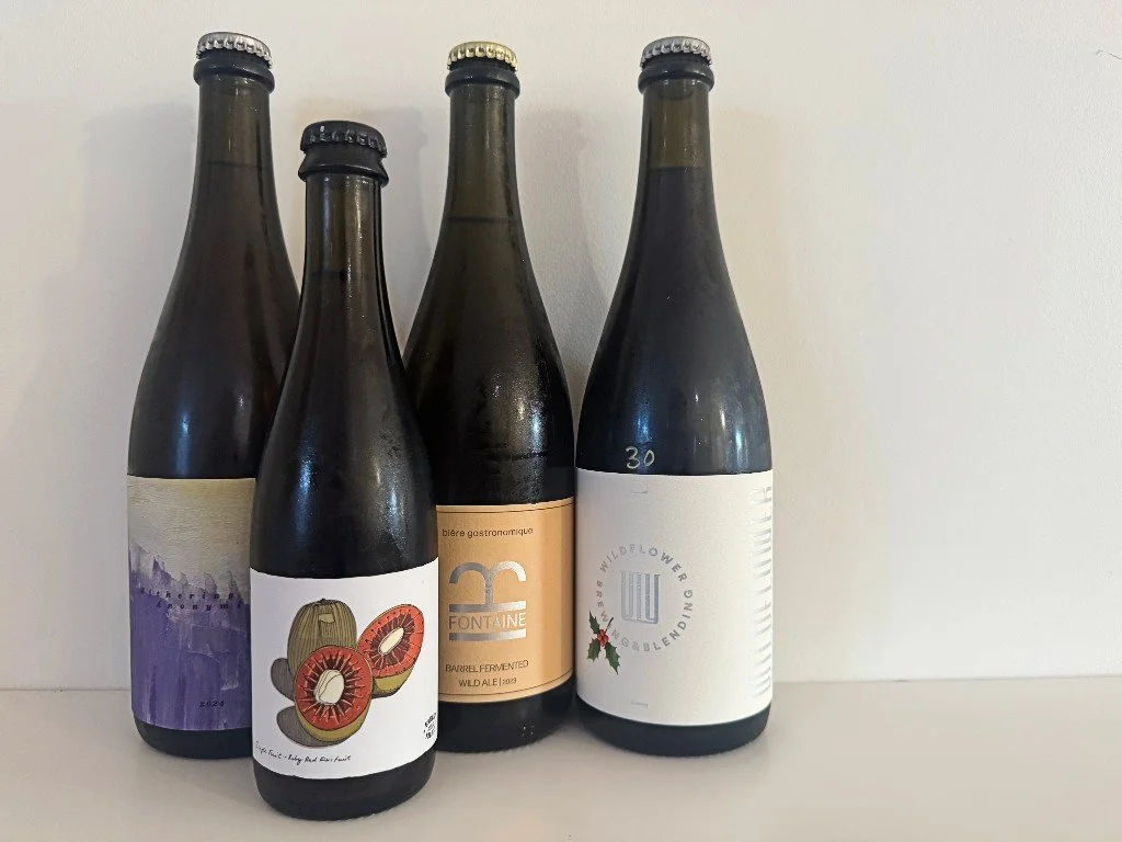 Bottles of Wildflower's Withering Into Anonymity, Wild Workshop's Garage Project Single Fruit Ruby Red Kiwifruit, Fontaine's Barrel Fermented Wild Ale and Wildflower's Noel.