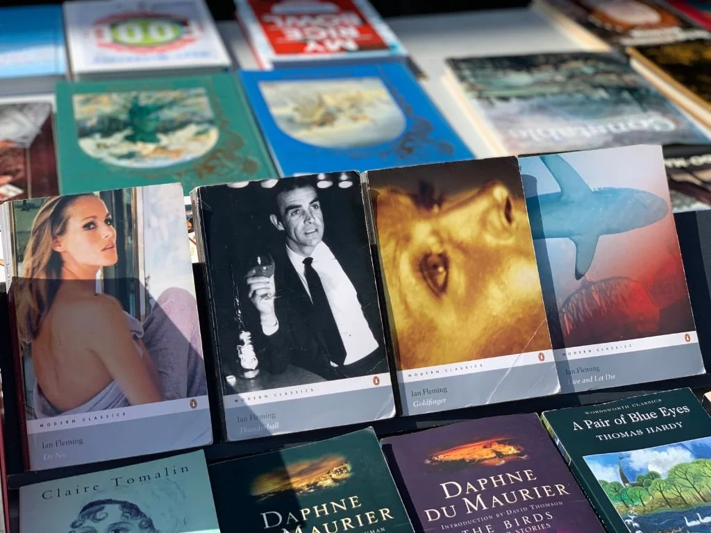 ables stacked with second-hand books at the South Bank Book Market under Waterloo Bridge.