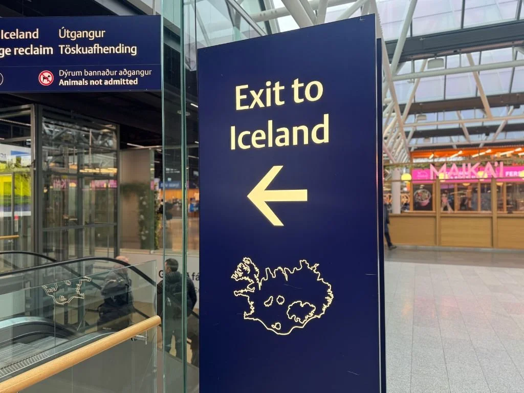 Sign saying 'Exit to Iceland' at Keflavík International Airport