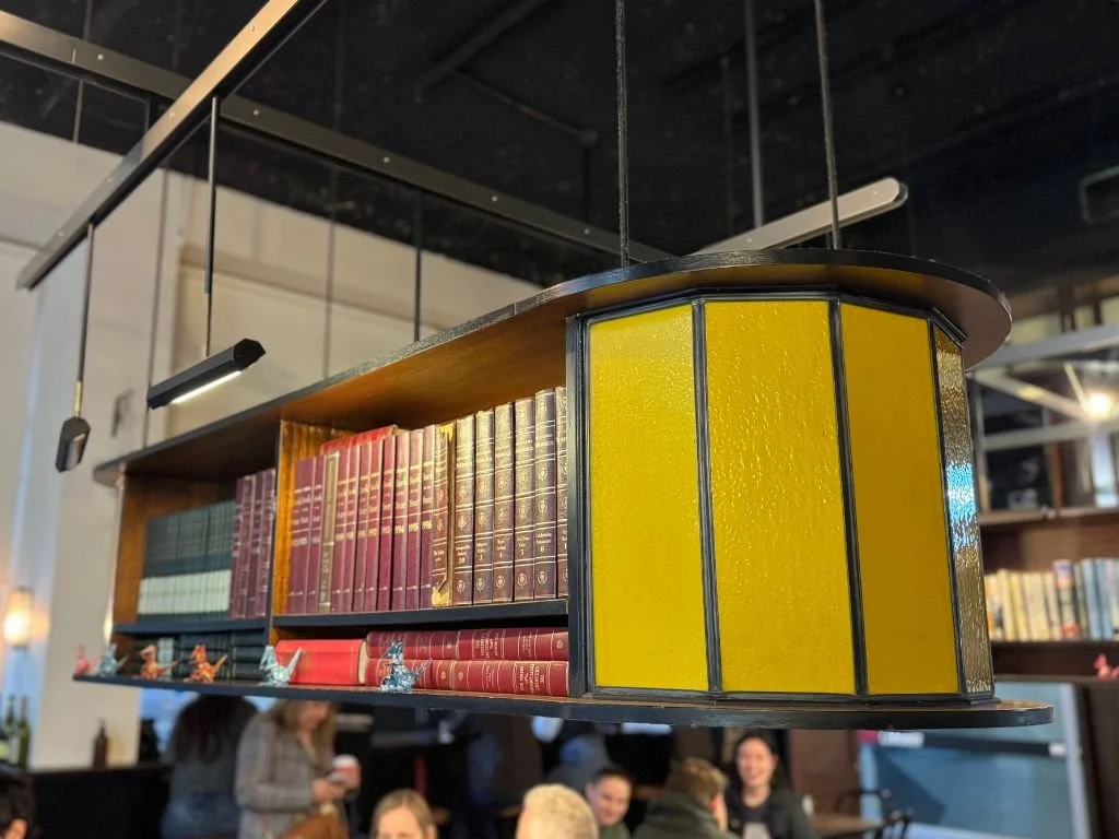 The hanging bookshelves at the Journal Cafe, Melbourne