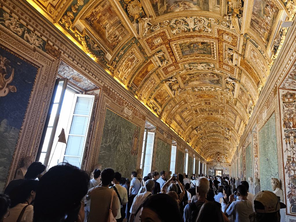 Large crowds fill the Gallery of Maps in the Vatican Museum