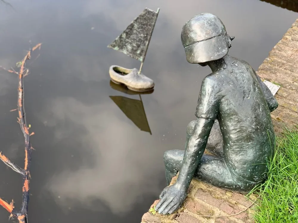 Boy and clog statue