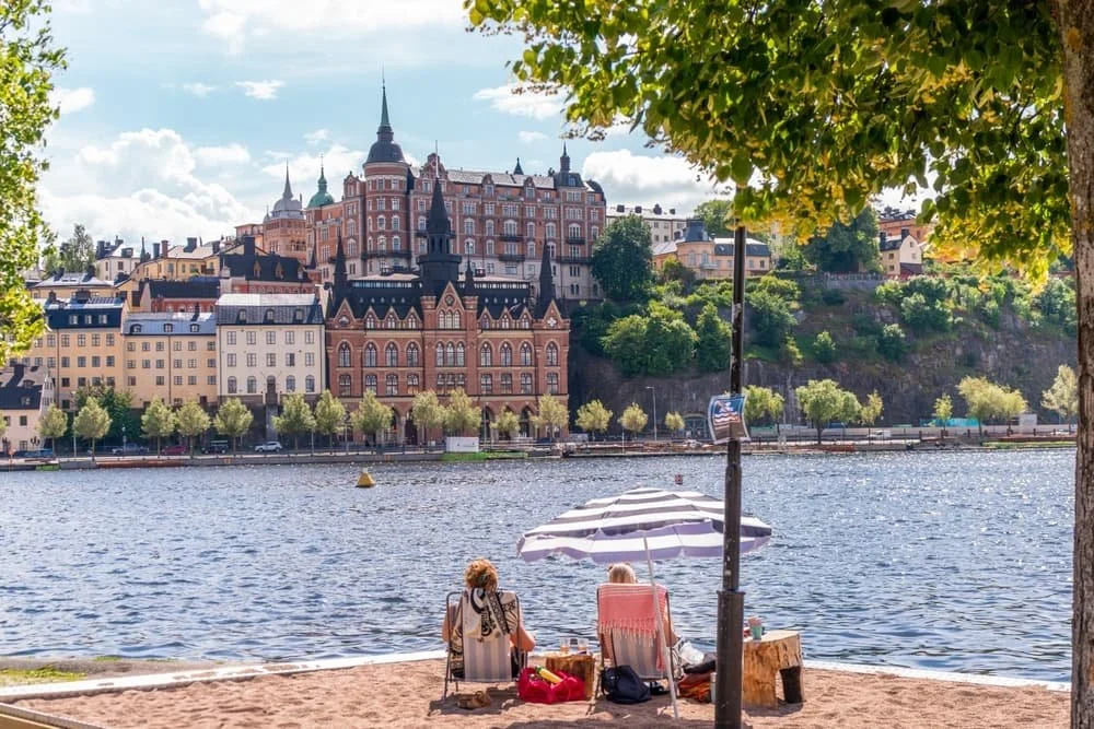 beach and cityscape along the waterfront in stockholm sweden
