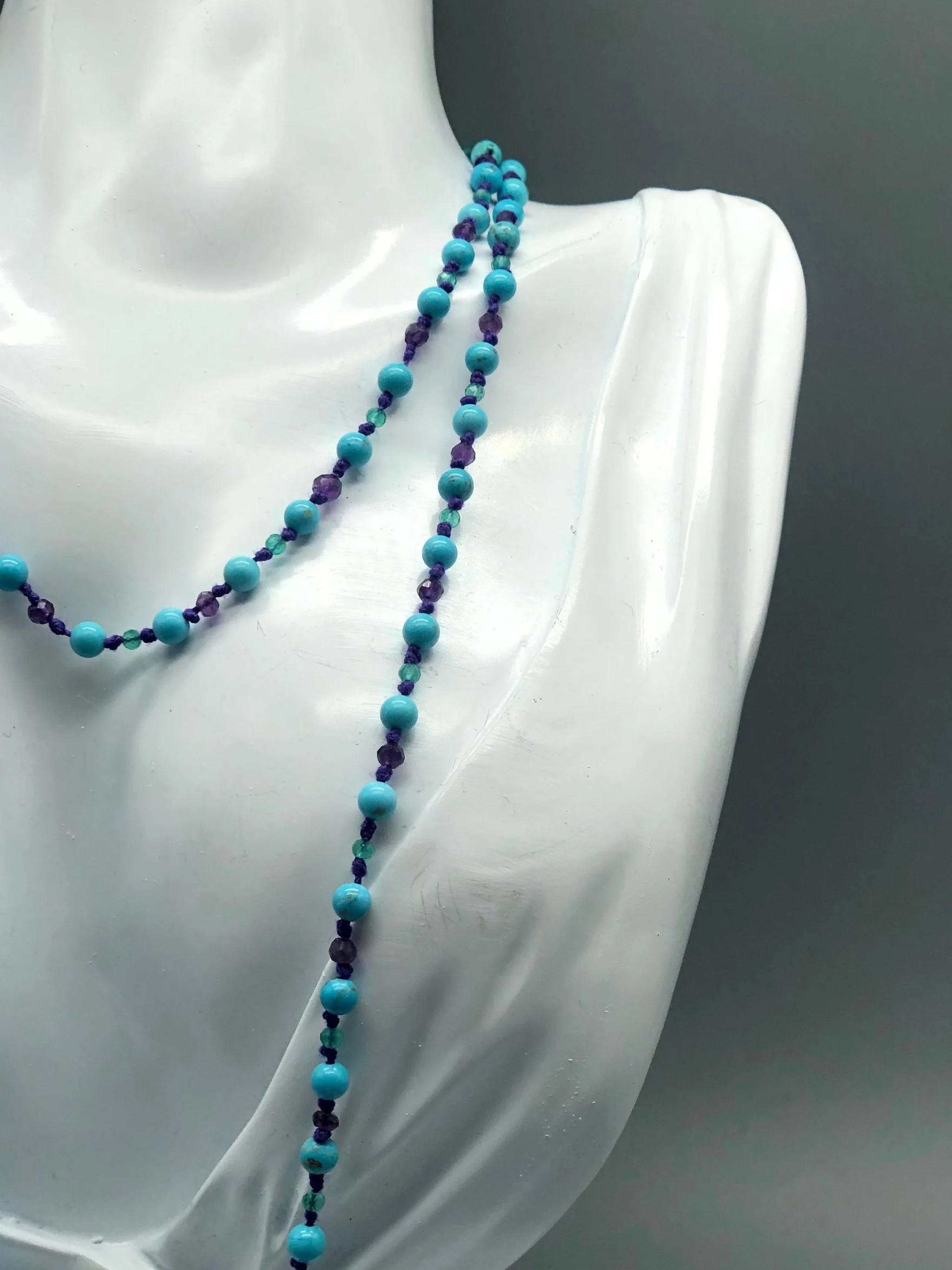 Summer necklace with turquoise, amethyst and aventurine on purple cotton cord. Crepundia Gioielli Bologna.