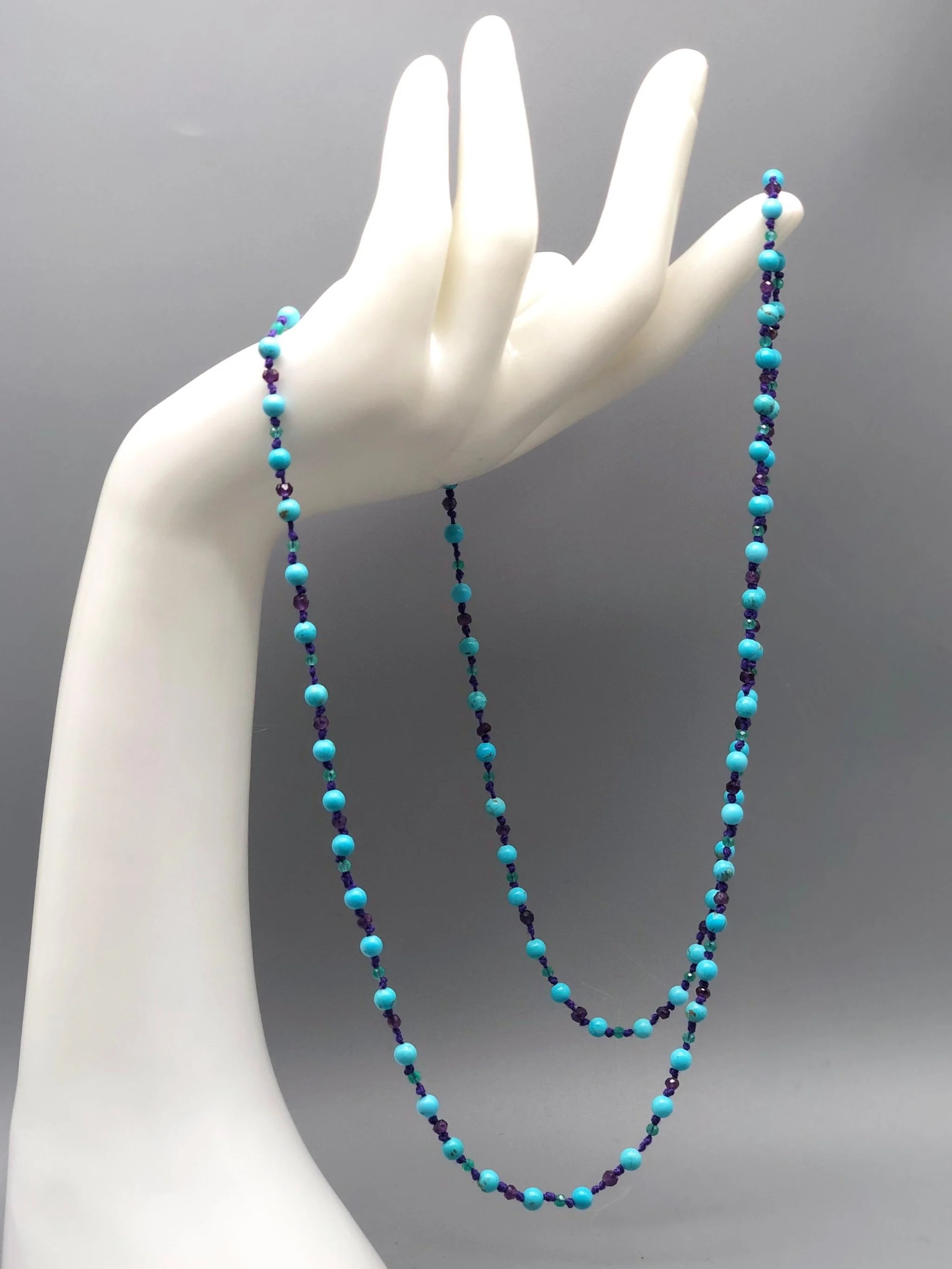 Summer necklace with turquoise, amethyst and aventurine on purple cotton cord. Crepundia Gioielli Bologna.