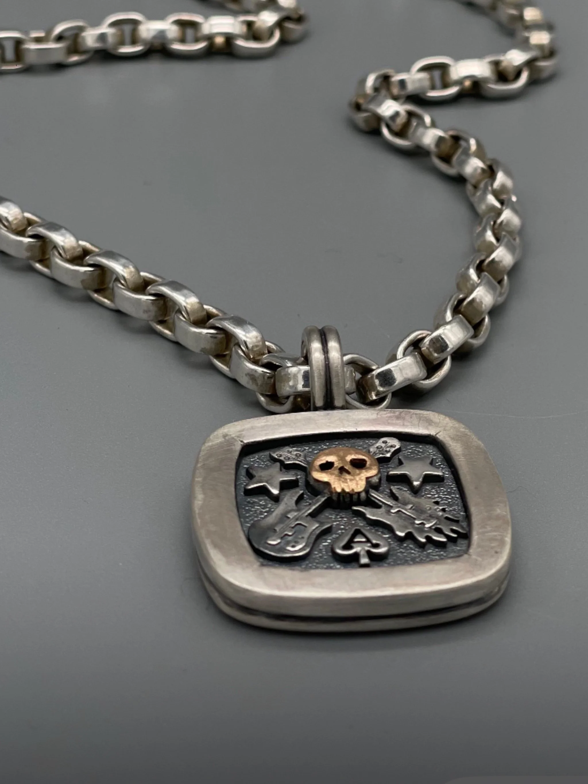 Sonja Markhoff The Ace of Spades Tribute to Rock necklace in sterling silver and 18 kt rose gold for Crepundia Gioielli Bologna.