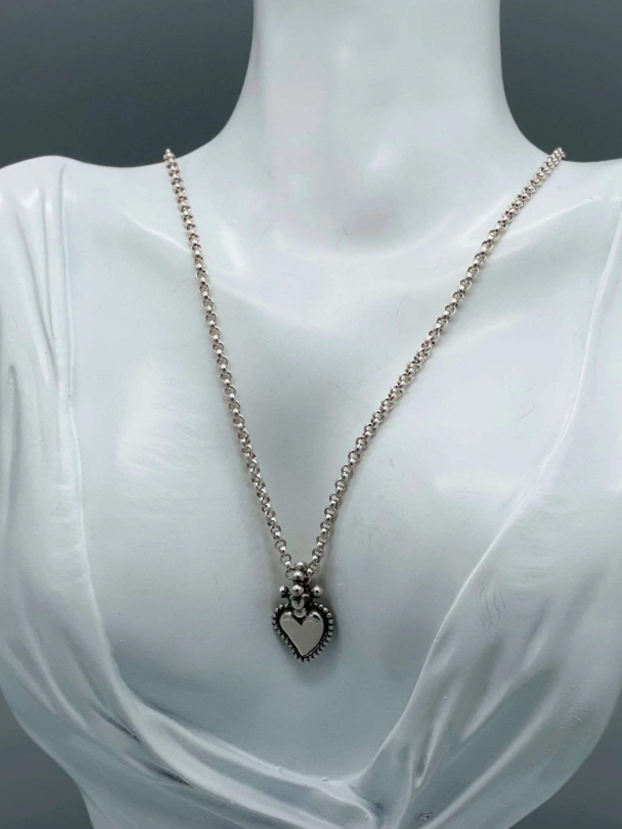 Sonja Markhoff Flaming Heart pendant in sterling silver, double-sided contemporary heart pendant by Crepundia Gioielli Bologna
