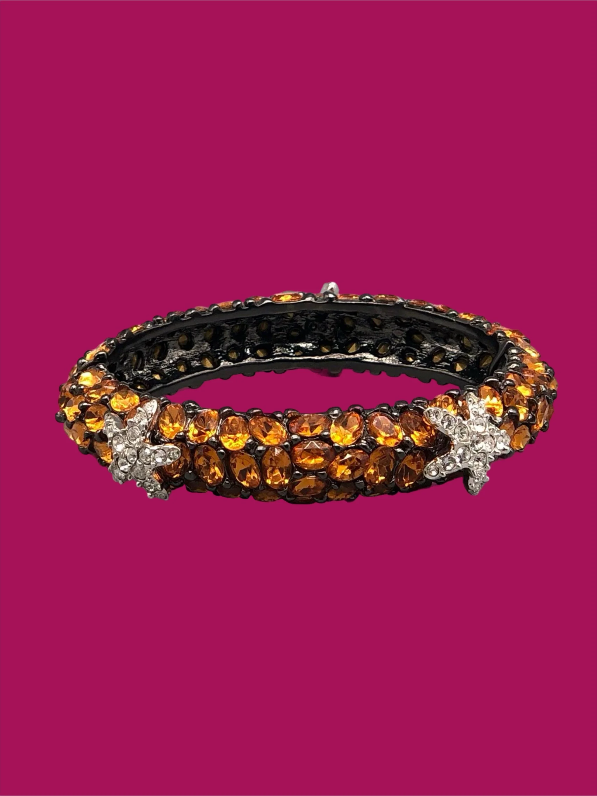 Kenneth Jay Lane costume jewelry bracelet with amber-colored crystals and starfish details, gold-tone rigid bracelet, Crepundia Gioielli Bologna