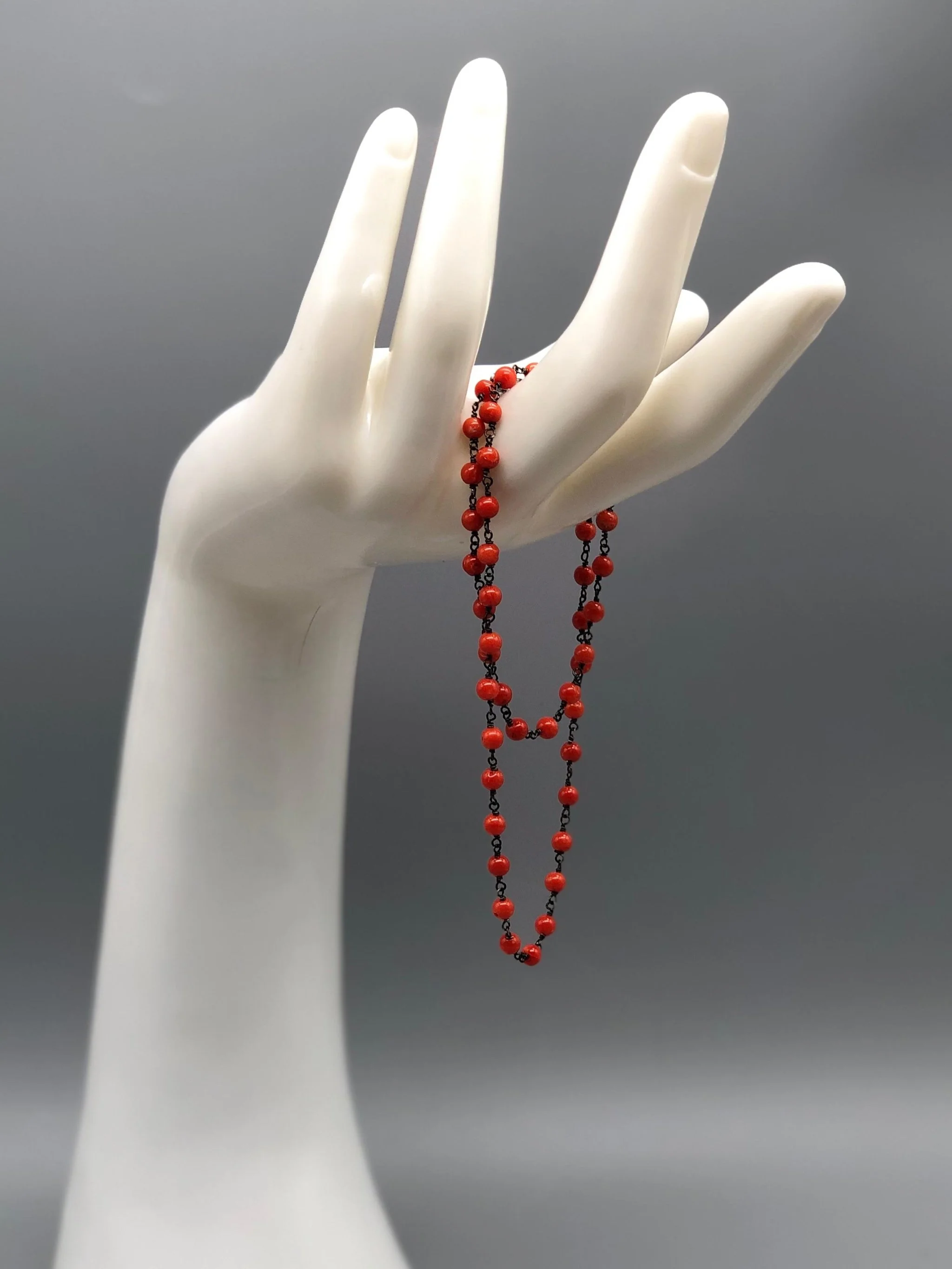 coral rosary necklace in oxidized sterling silver by Crepundia Gioielli.
