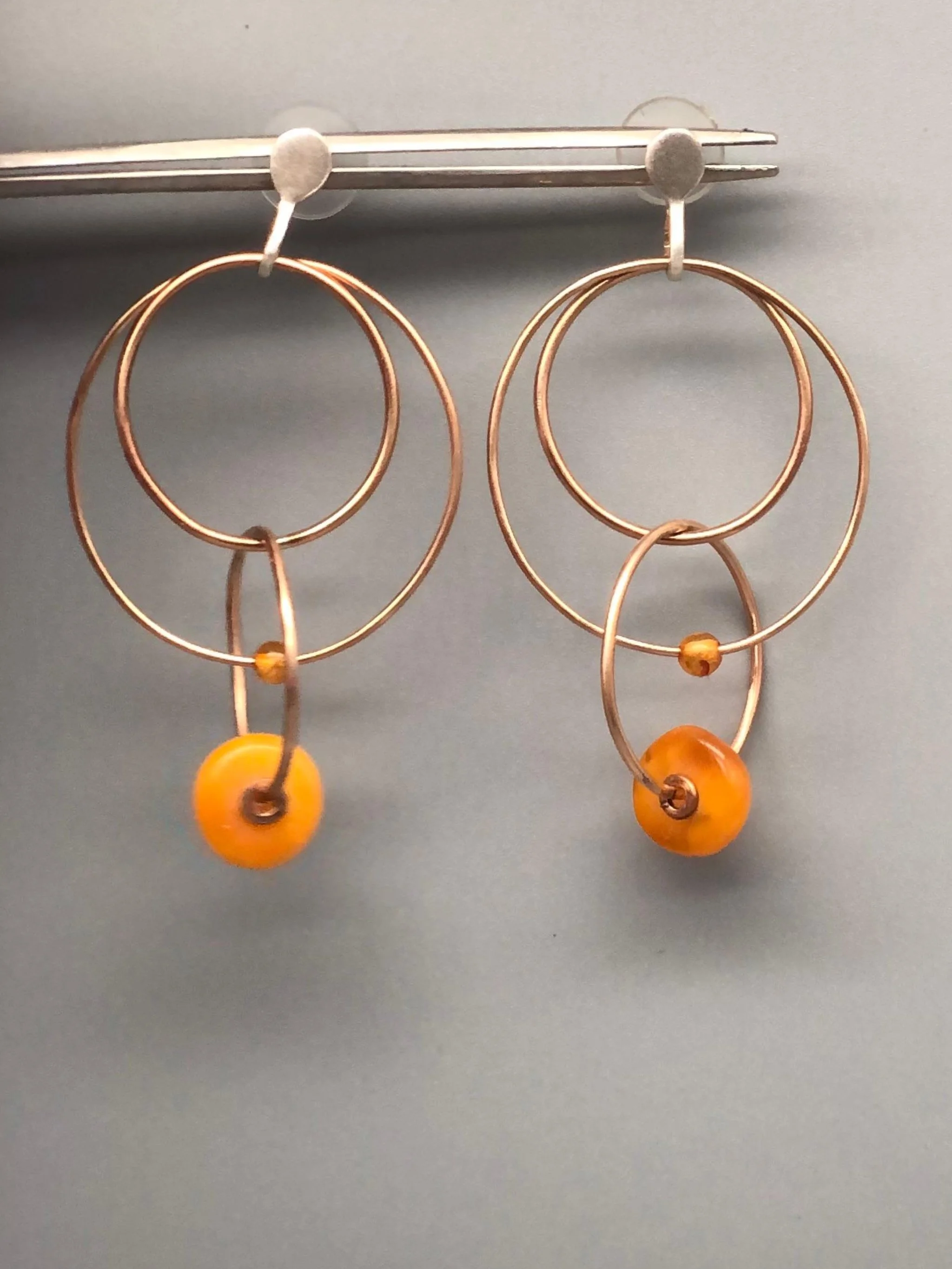 Padma Multicerchio bronze earrings with Morocco amber, Crepundia Gioielli Bologna.